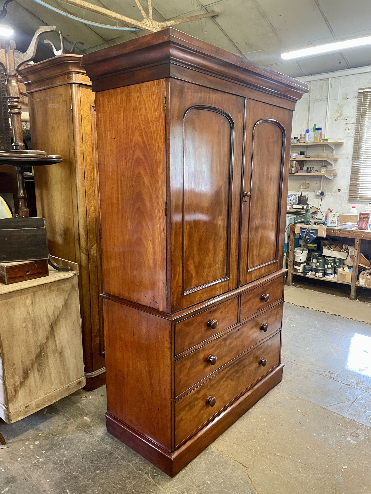 Wooden wardrobe with drawers in a storage or warehouse setting