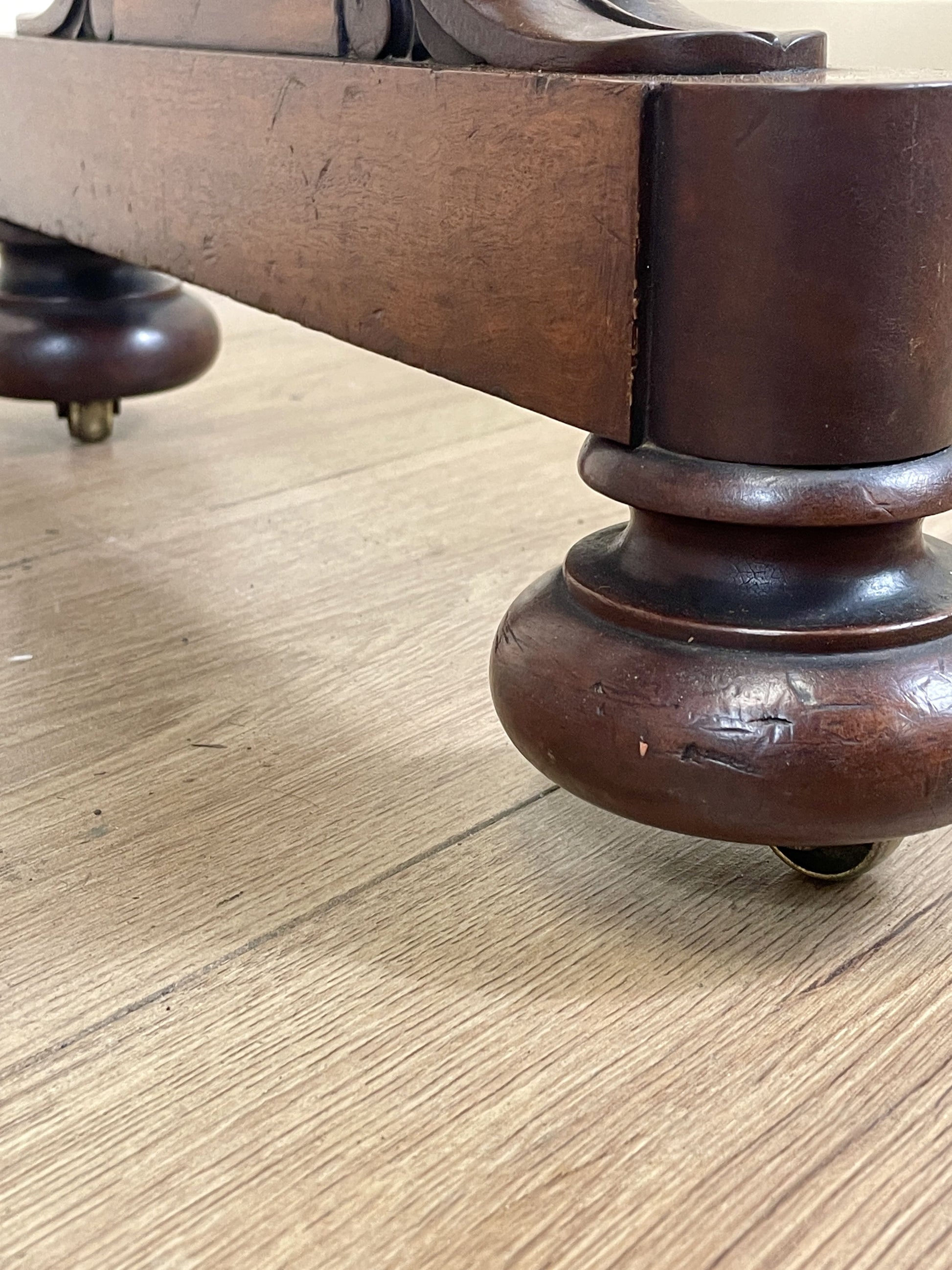 Close-up of wooden furniture legs on a wooden floor