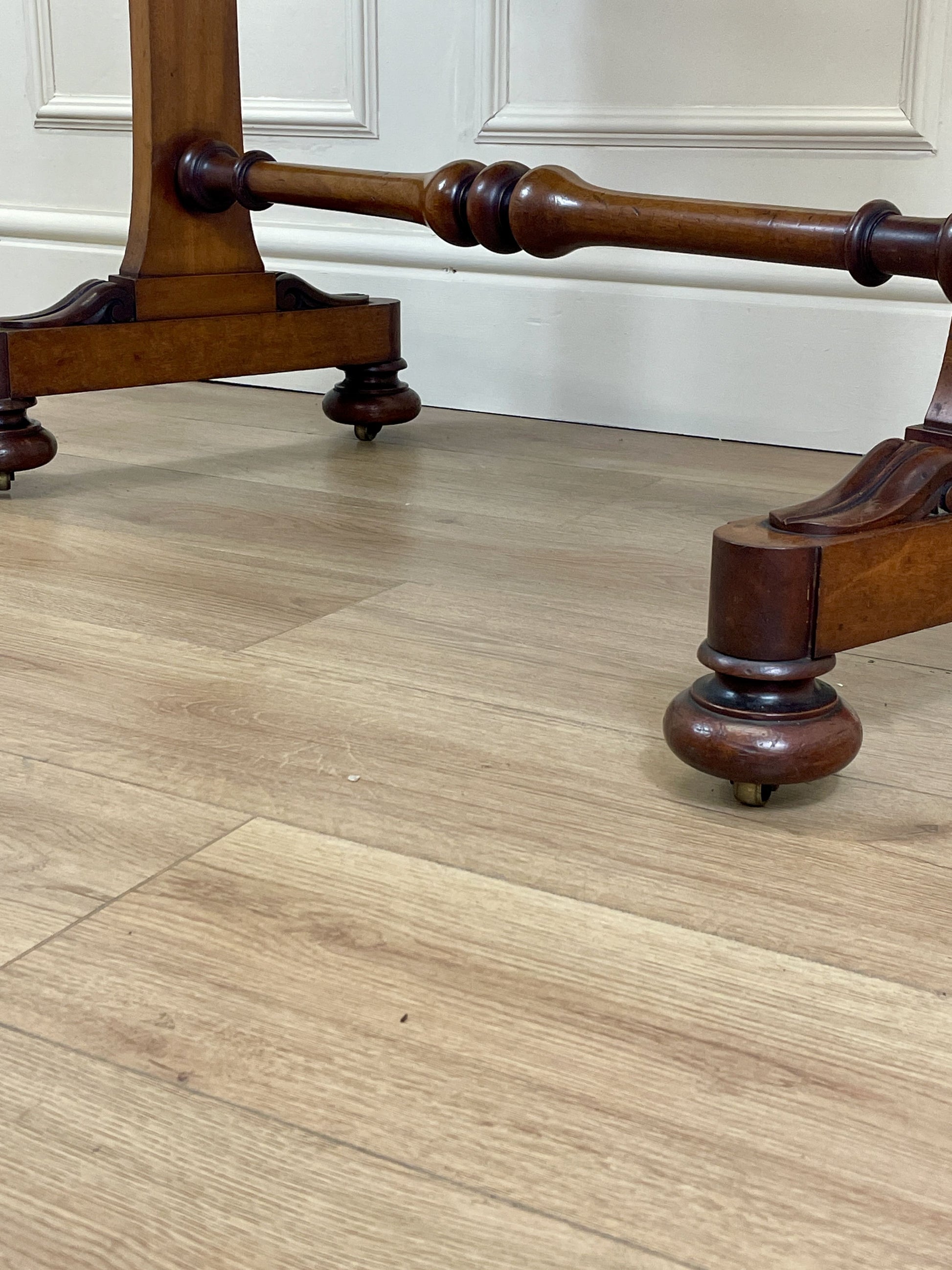 Wooden furniture legs on a wooden floor