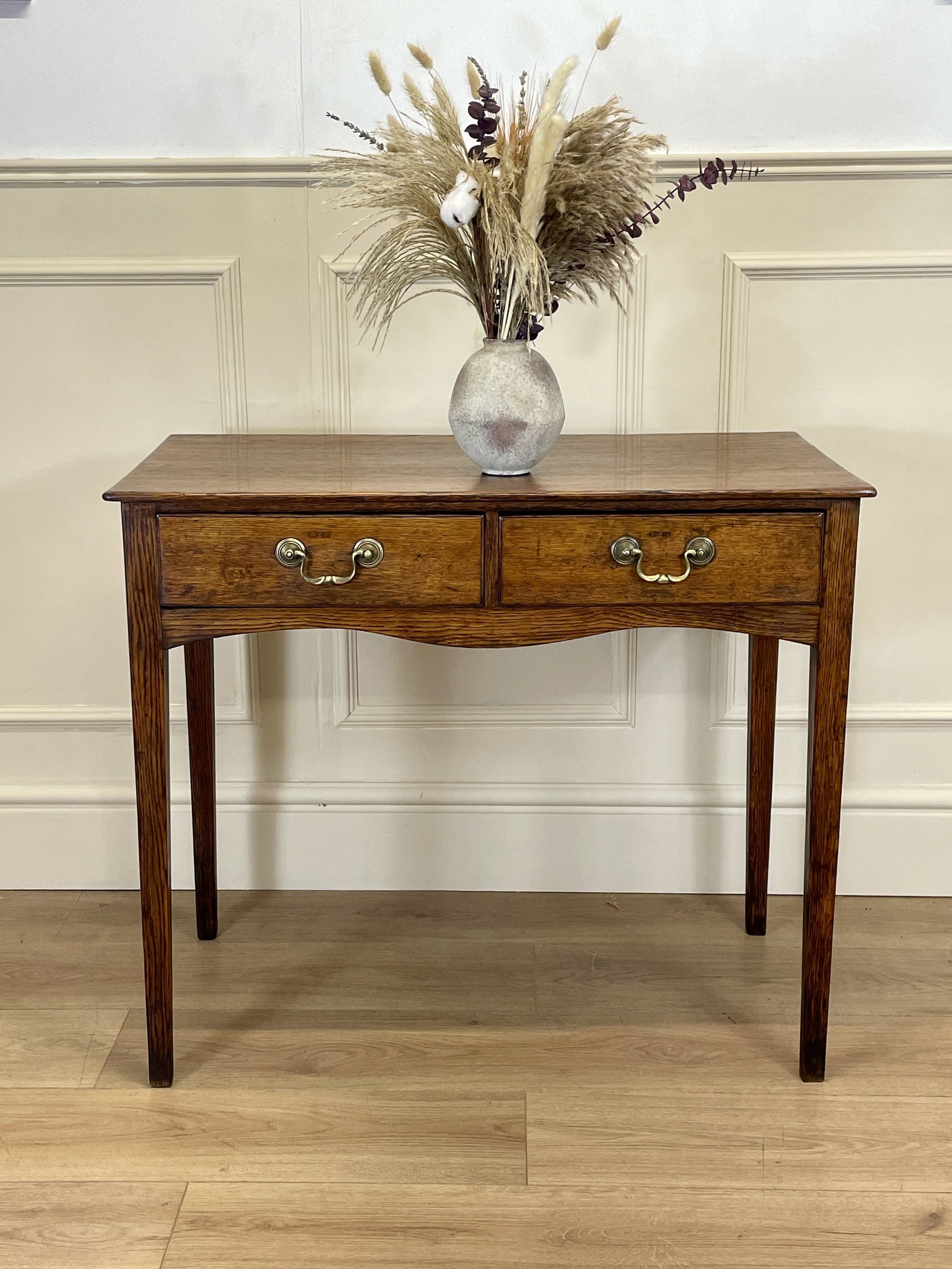 Antique oak side table with two drawers in light oak finish