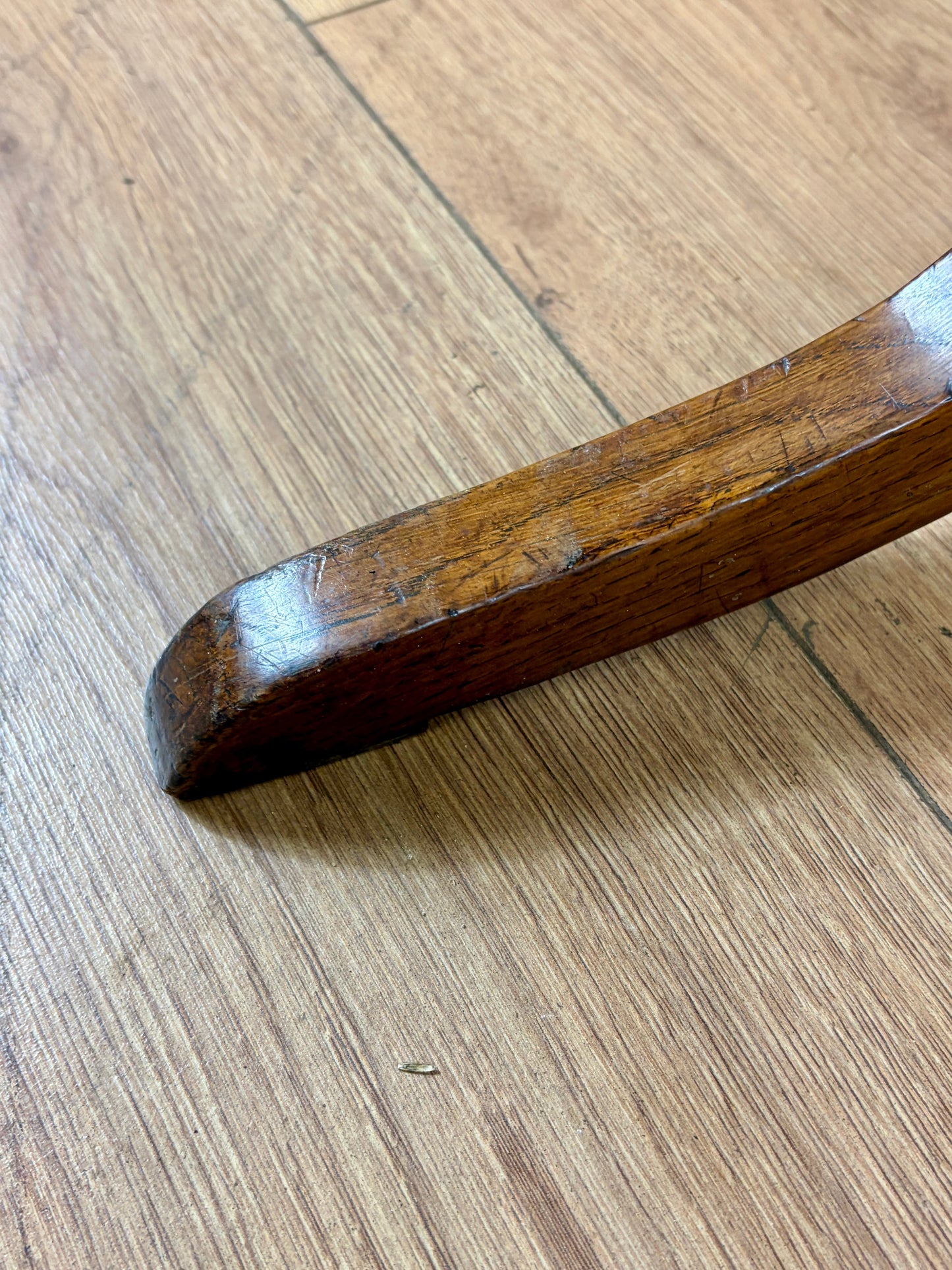 Antique Georgian oak tripod tilt-top table with oval top and tripod base in light oak finish.