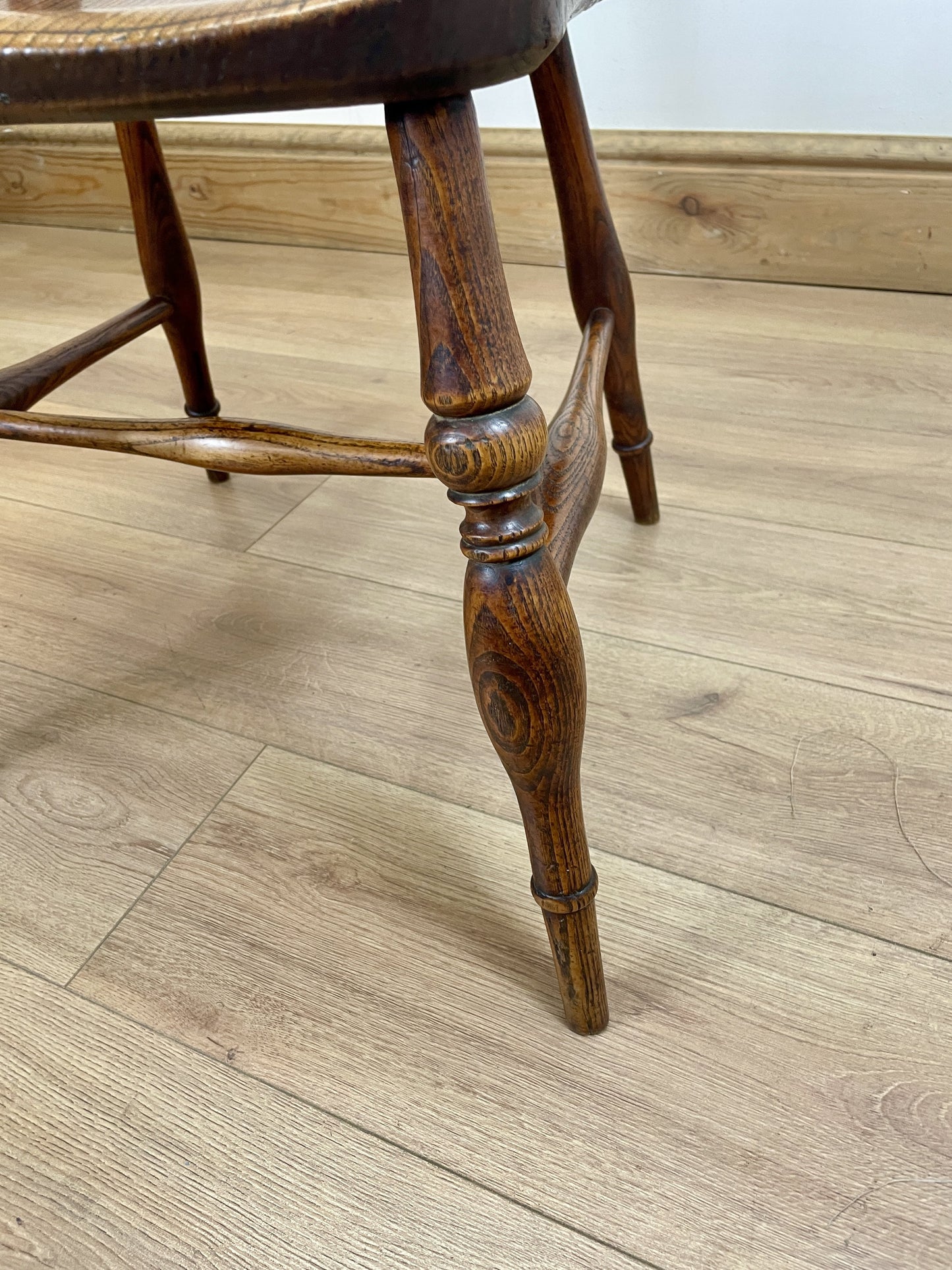 Wooden stool leg on a wooden floor