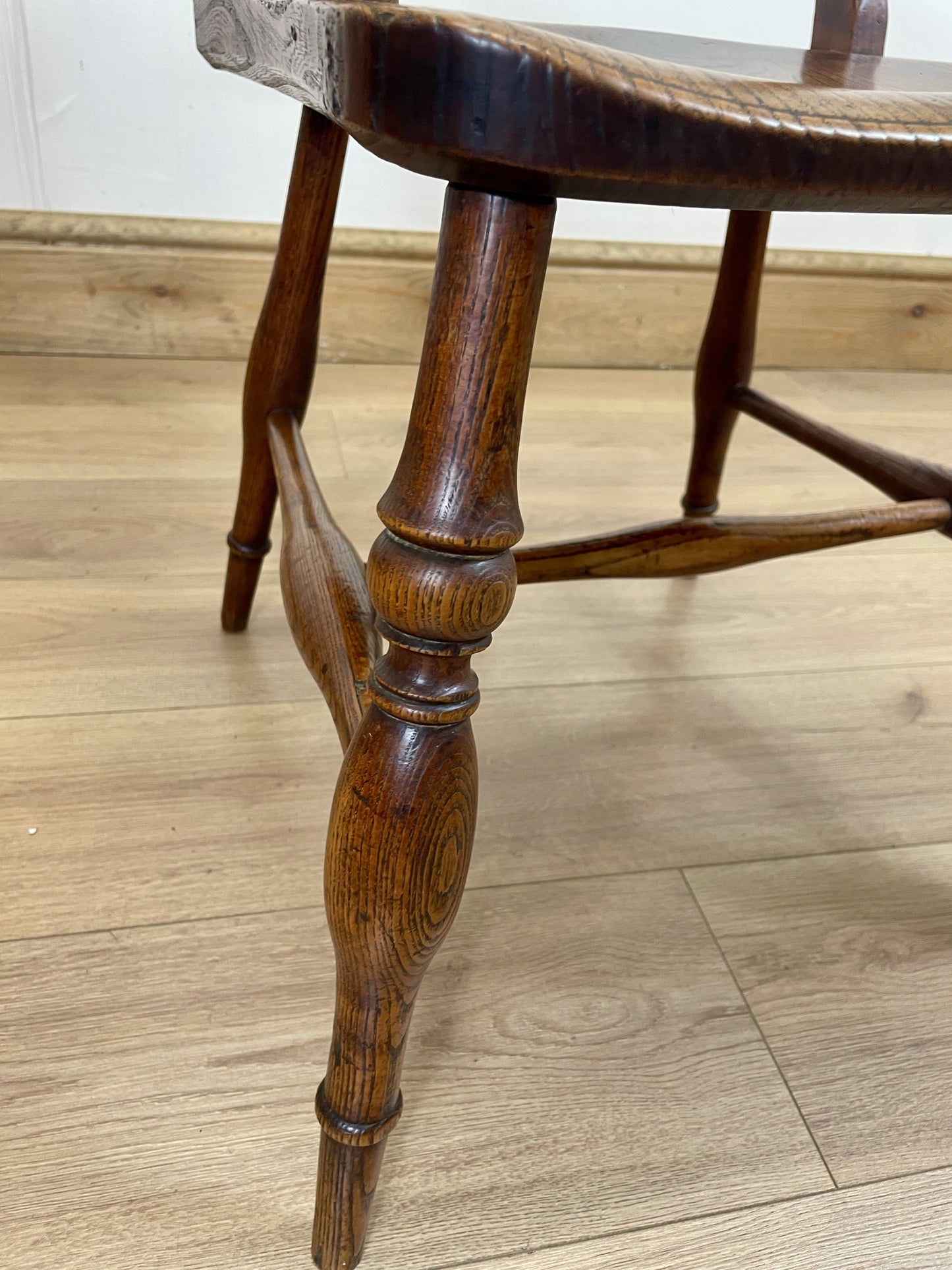 Wooden chair leg on a wooden floor