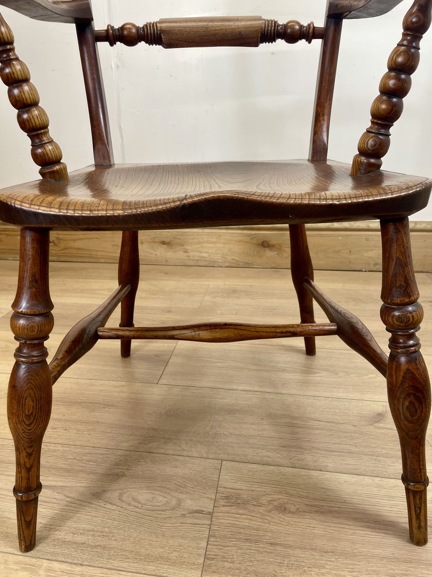 Wooden chair with turned legs on a wooden floor