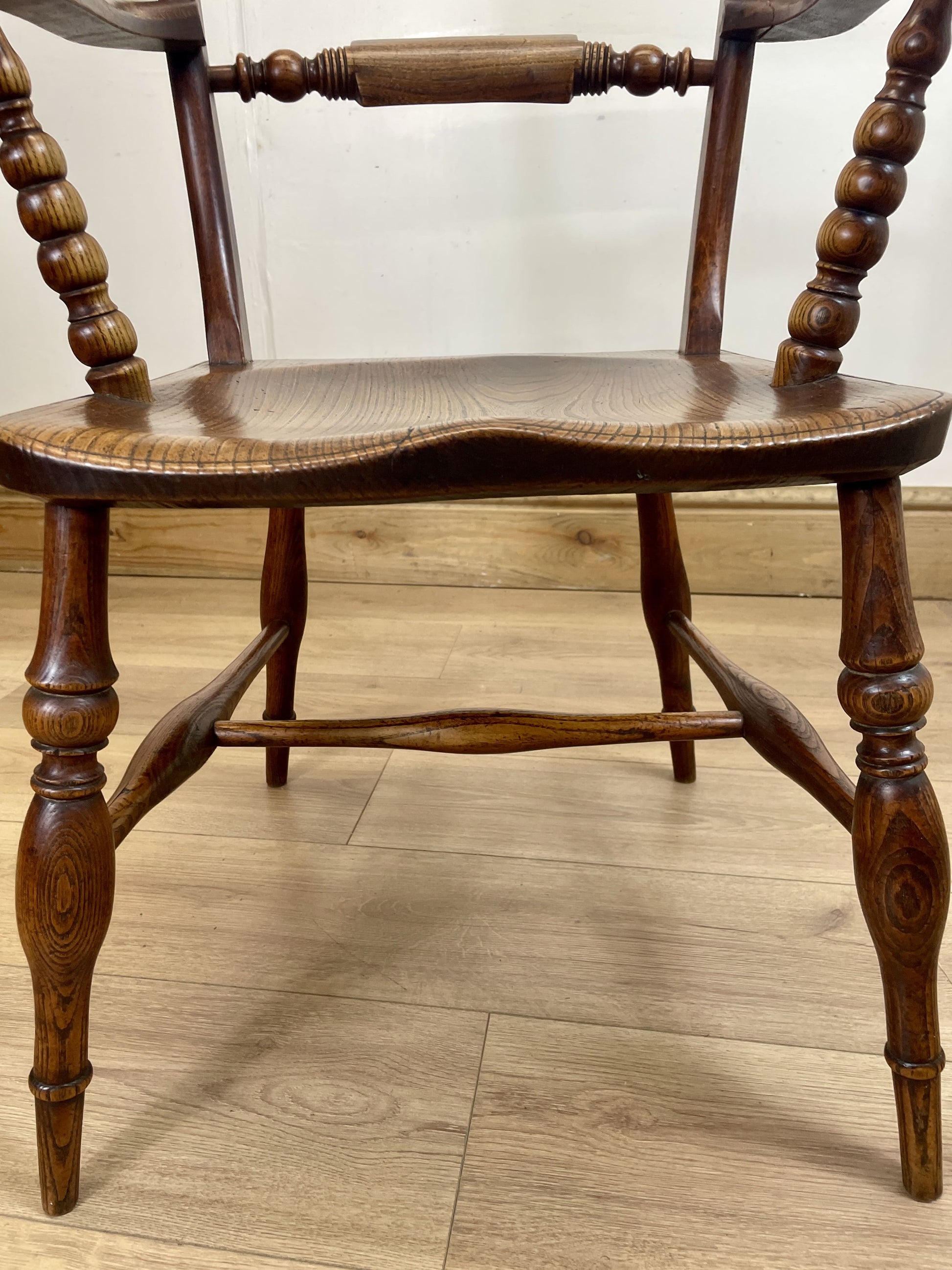 Wooden chair with turned legs on a wooden floor