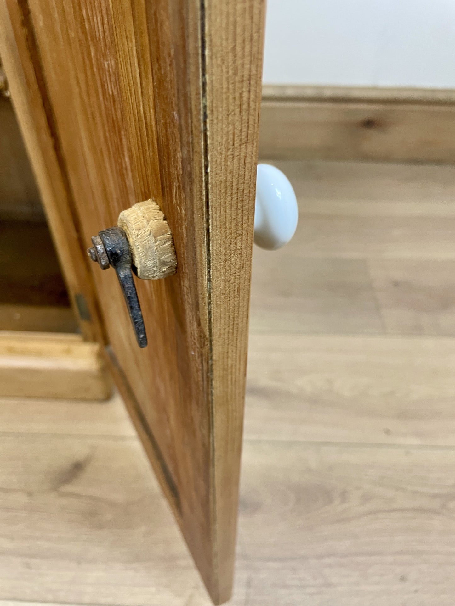 Wooden cabinet with a small object on top of it