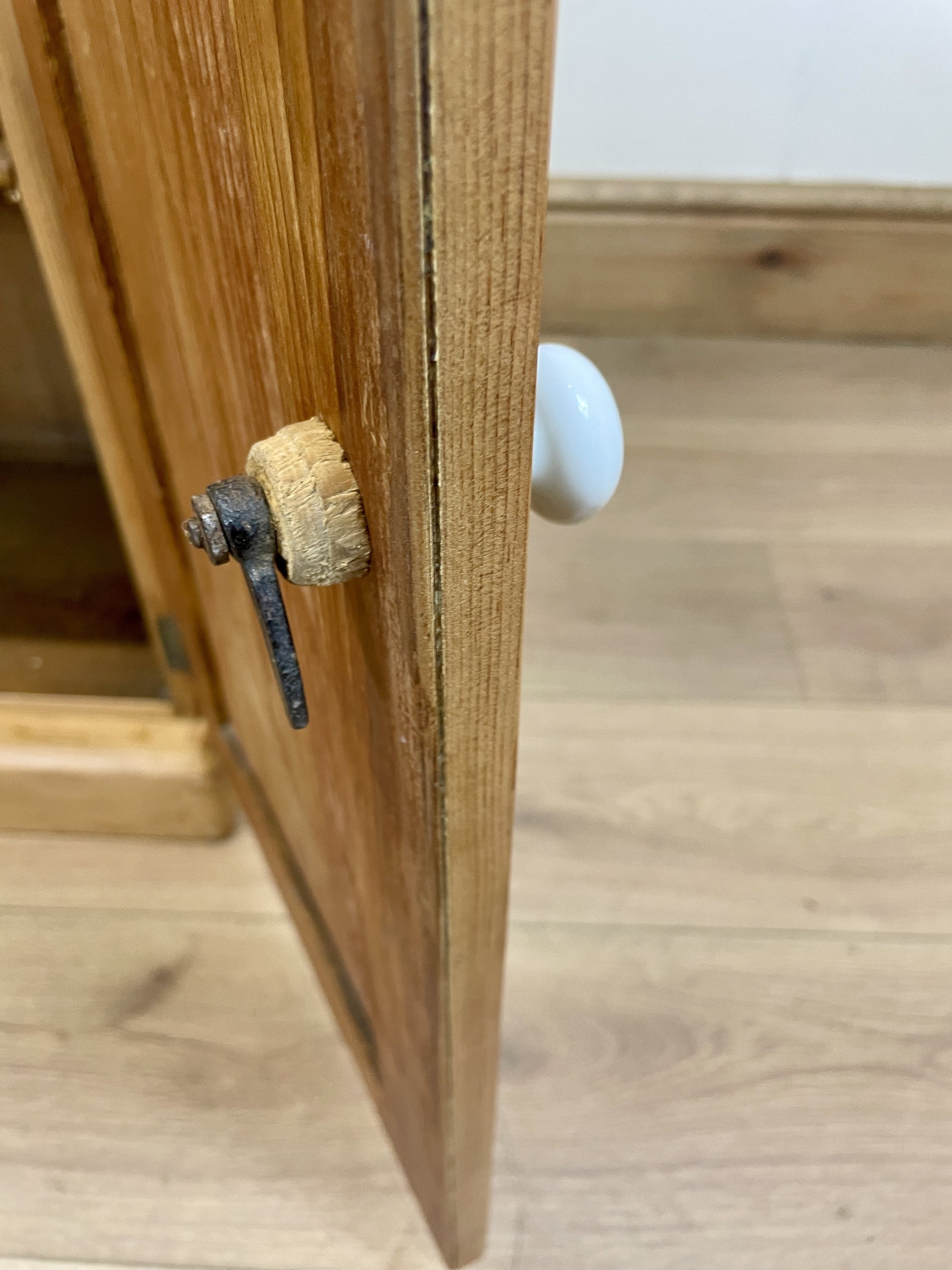 Wooden cabinet with a small object on top of it