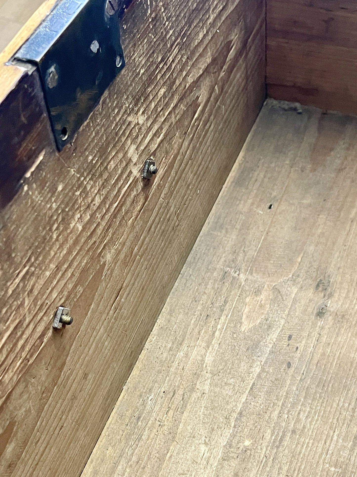 Close-up of wooden flooring with a visible seam between planks.