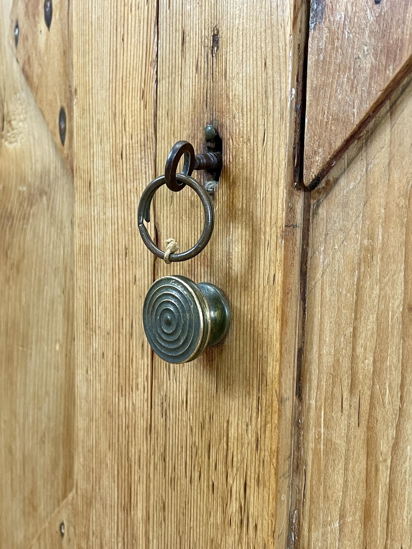 Metal door handle on a wooden door