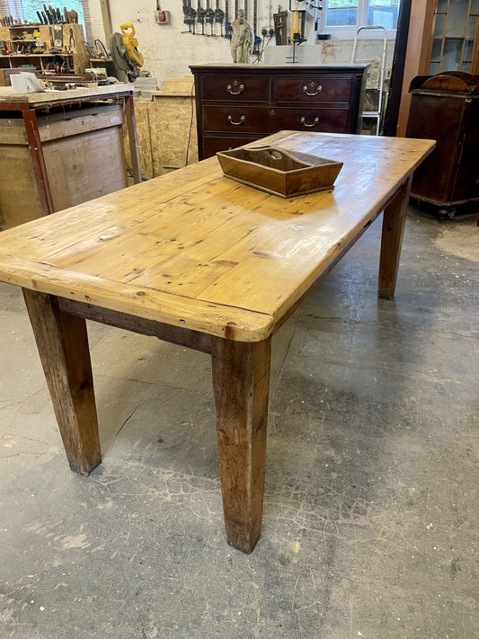 Old wooden table in a workshop setting