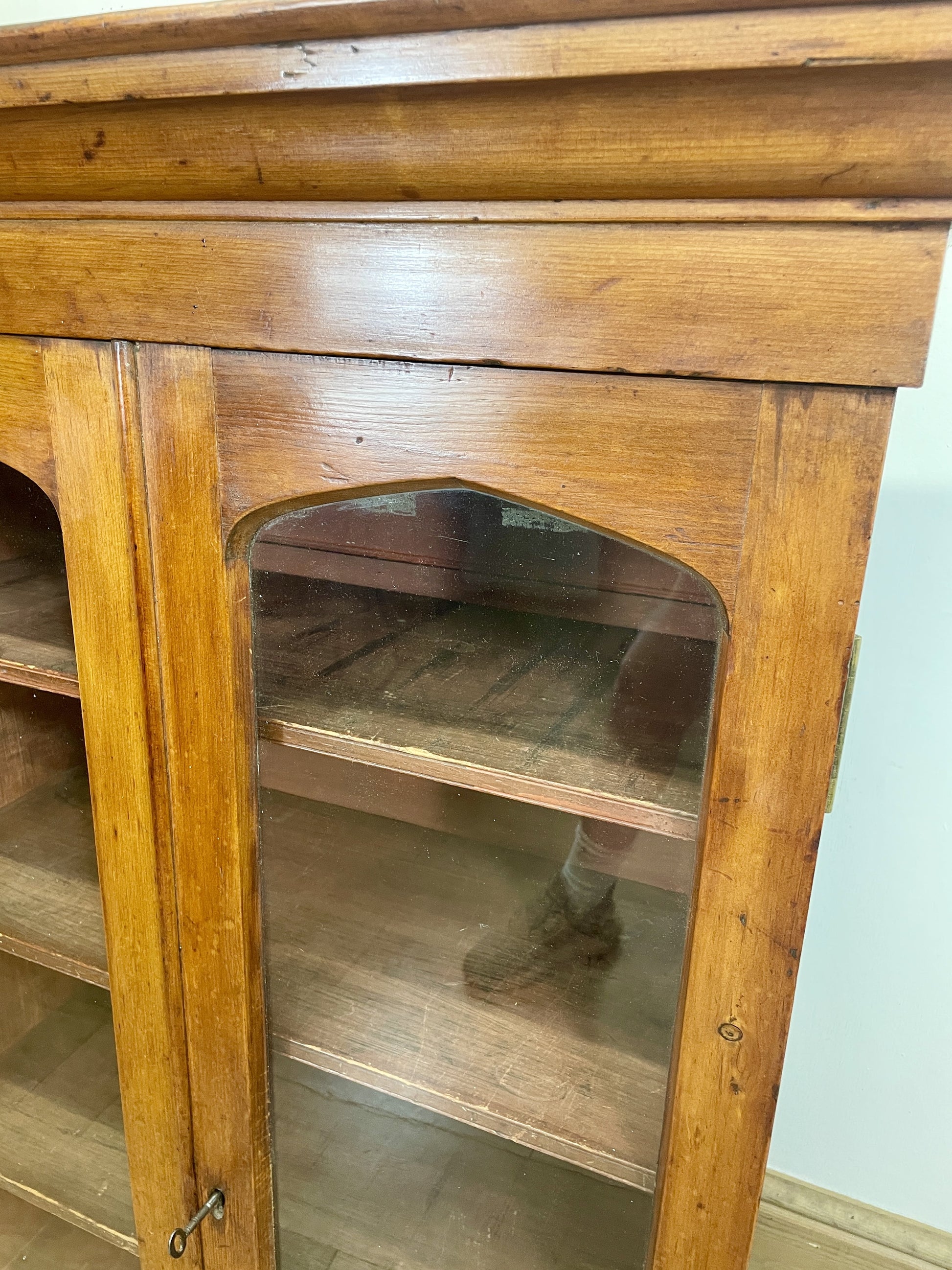 Wooden cabinet with glass door on a white background
