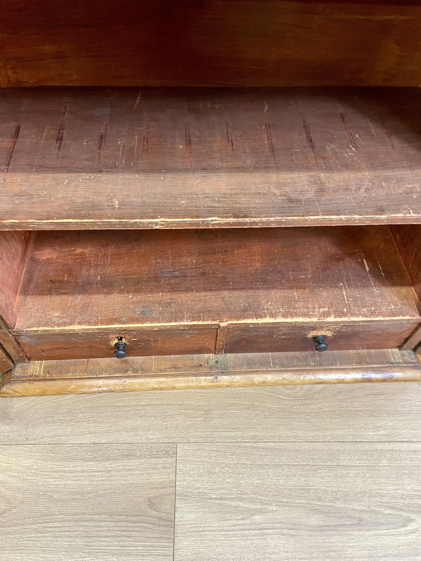 Wooden cabinet with two drawers on a wooden floor