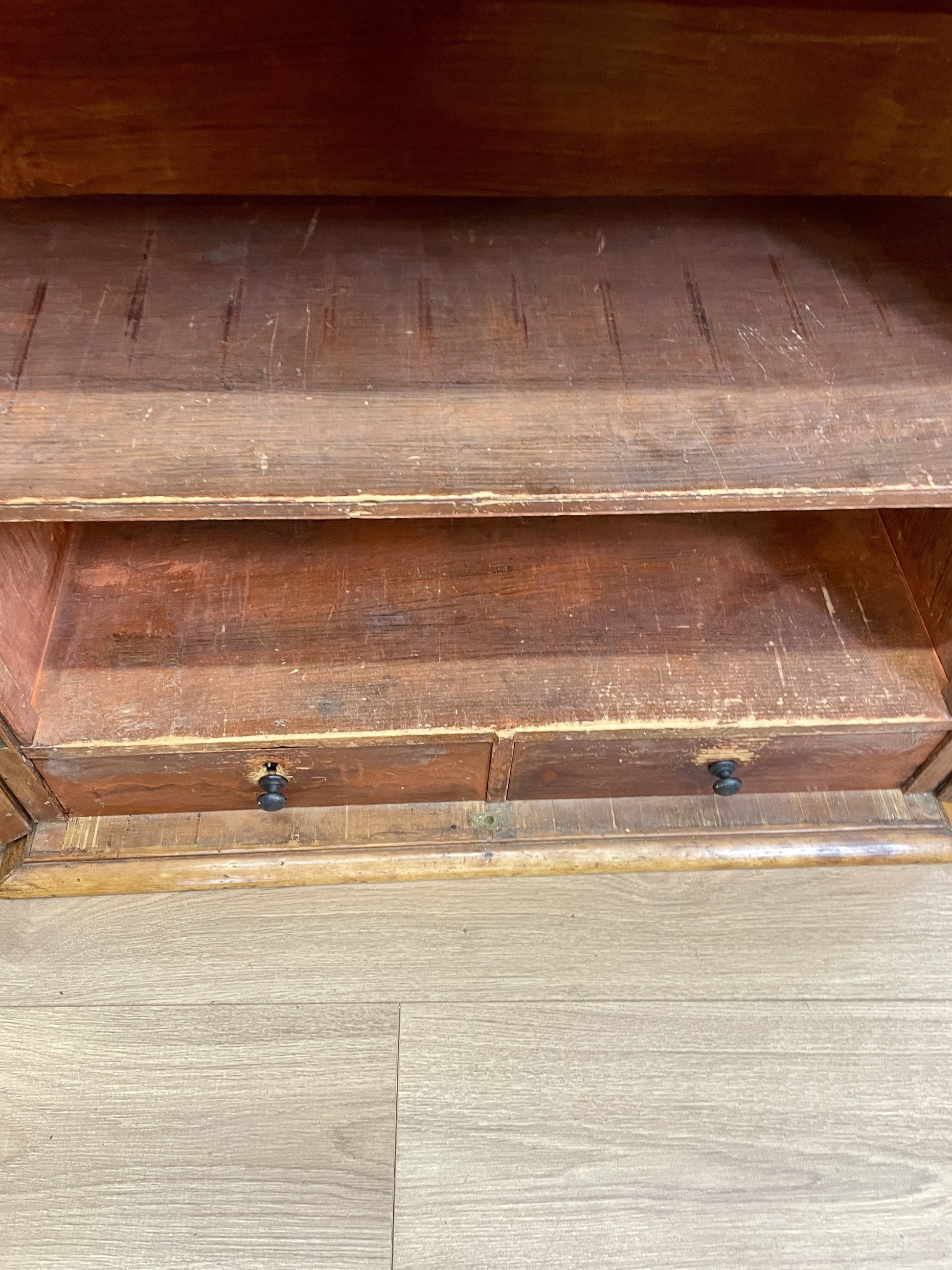 Wooden cabinet with two drawers on a wooden floor