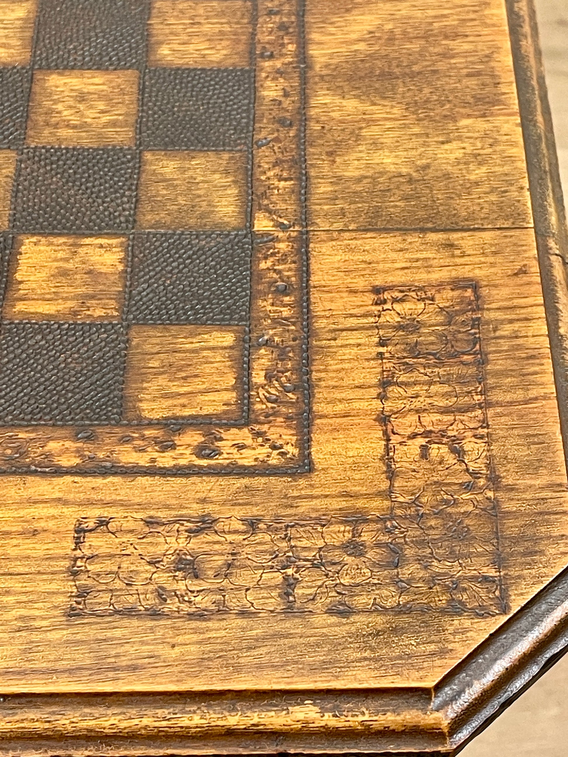 Close-up of a wooden chessboard with checkered pattern