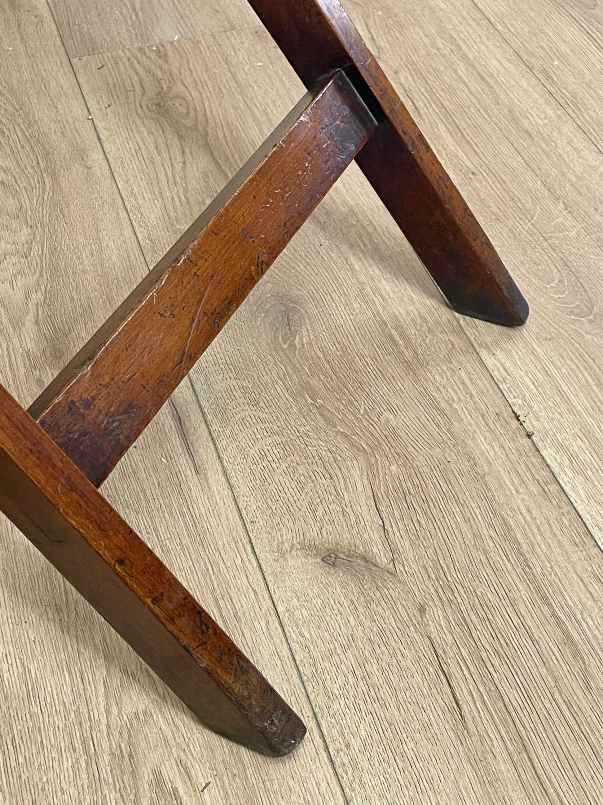 Wooden chair leg on a wooden floor
