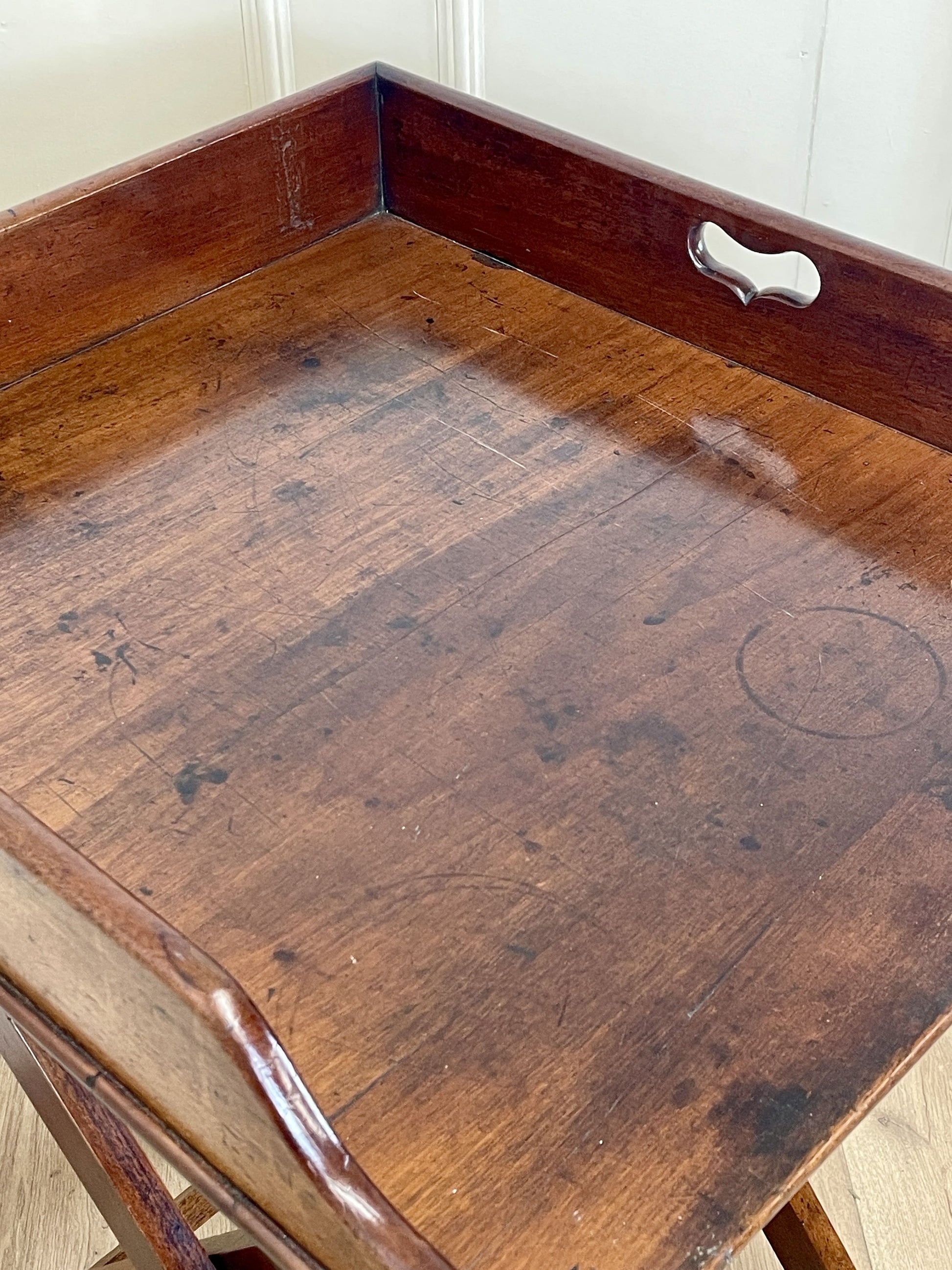 Wooden desk with a metal handle on a white background