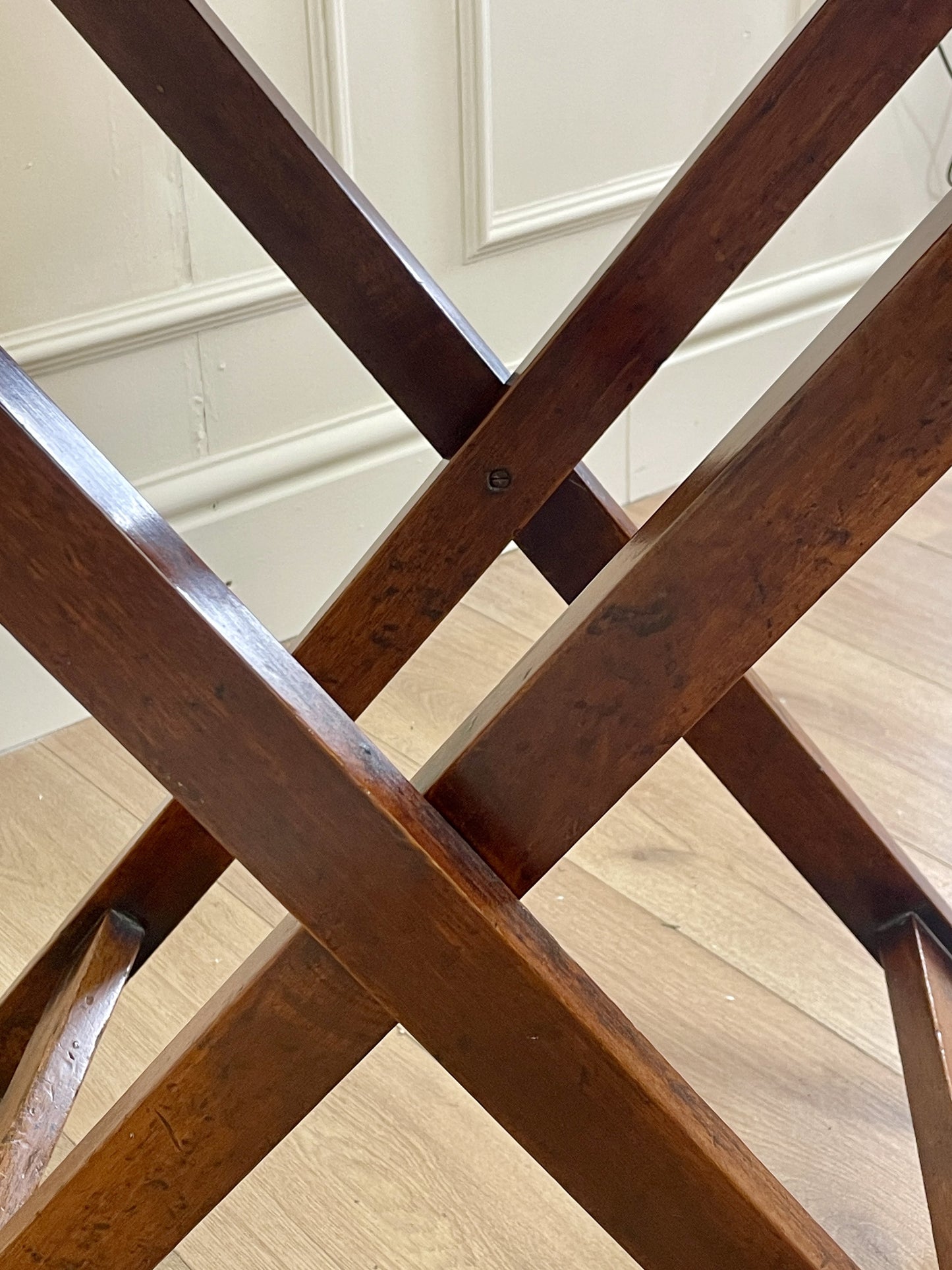 Close-up of wooden crossbars on a staircase with a neutral background