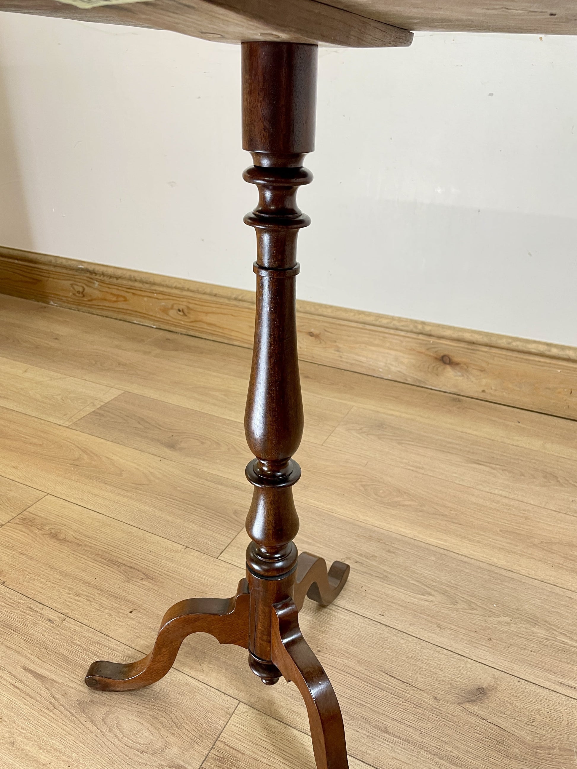 Wooden table base on a wooden floor