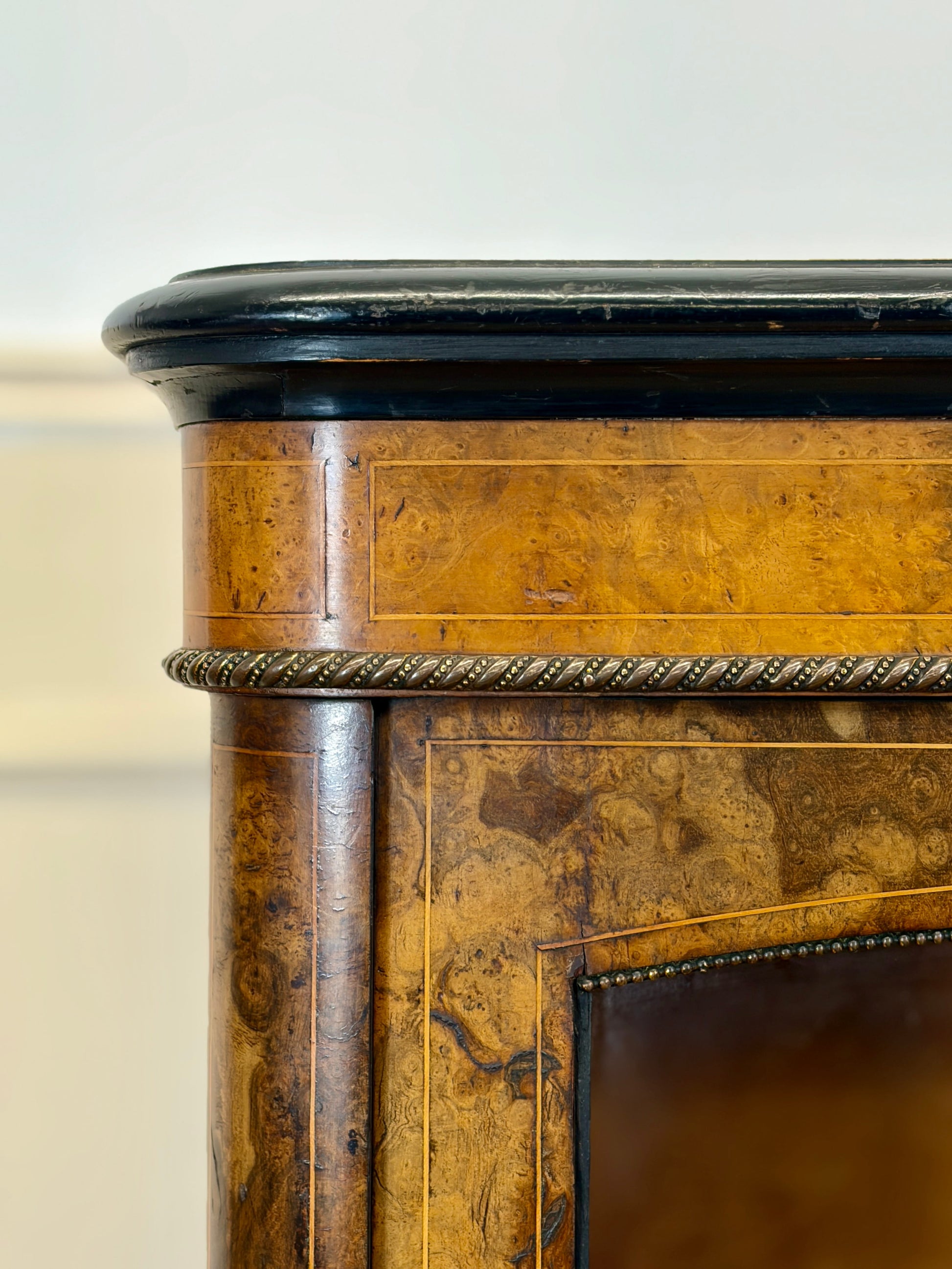 Close-up of a wooden furniture piece with decorative elements