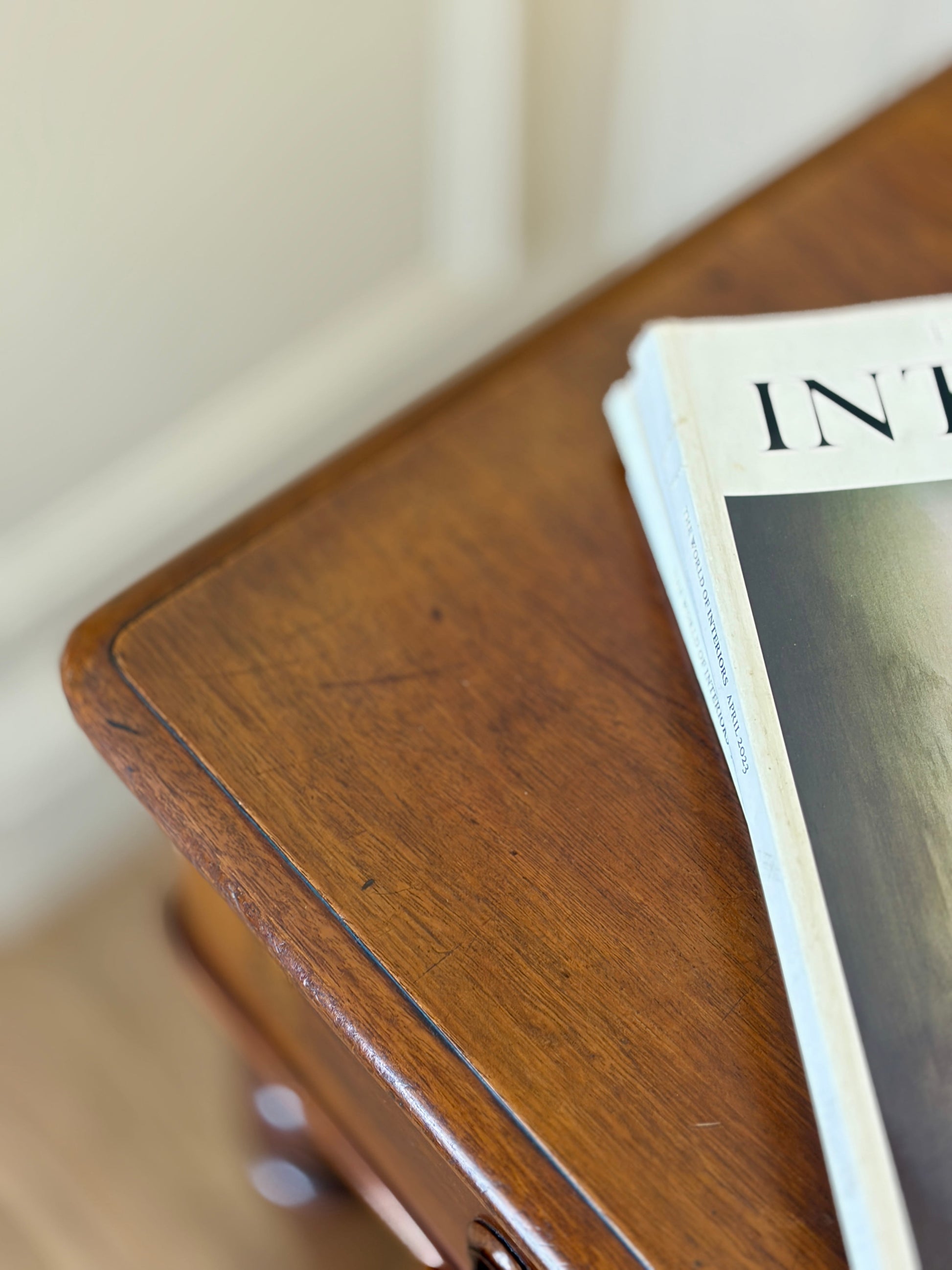 Wooden surface with a magazine on top