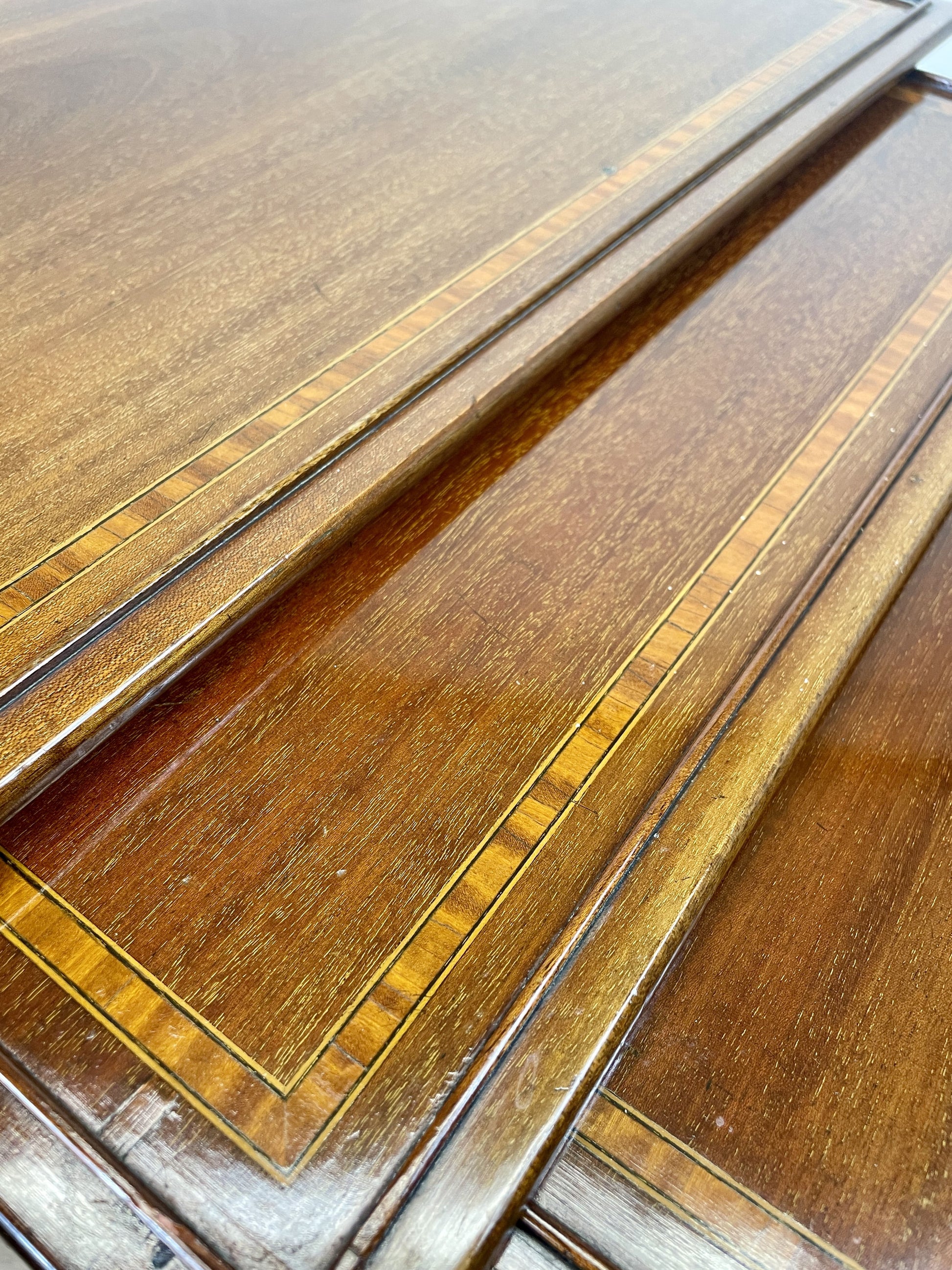 Close-up of a wooden surface with inlaid patterns