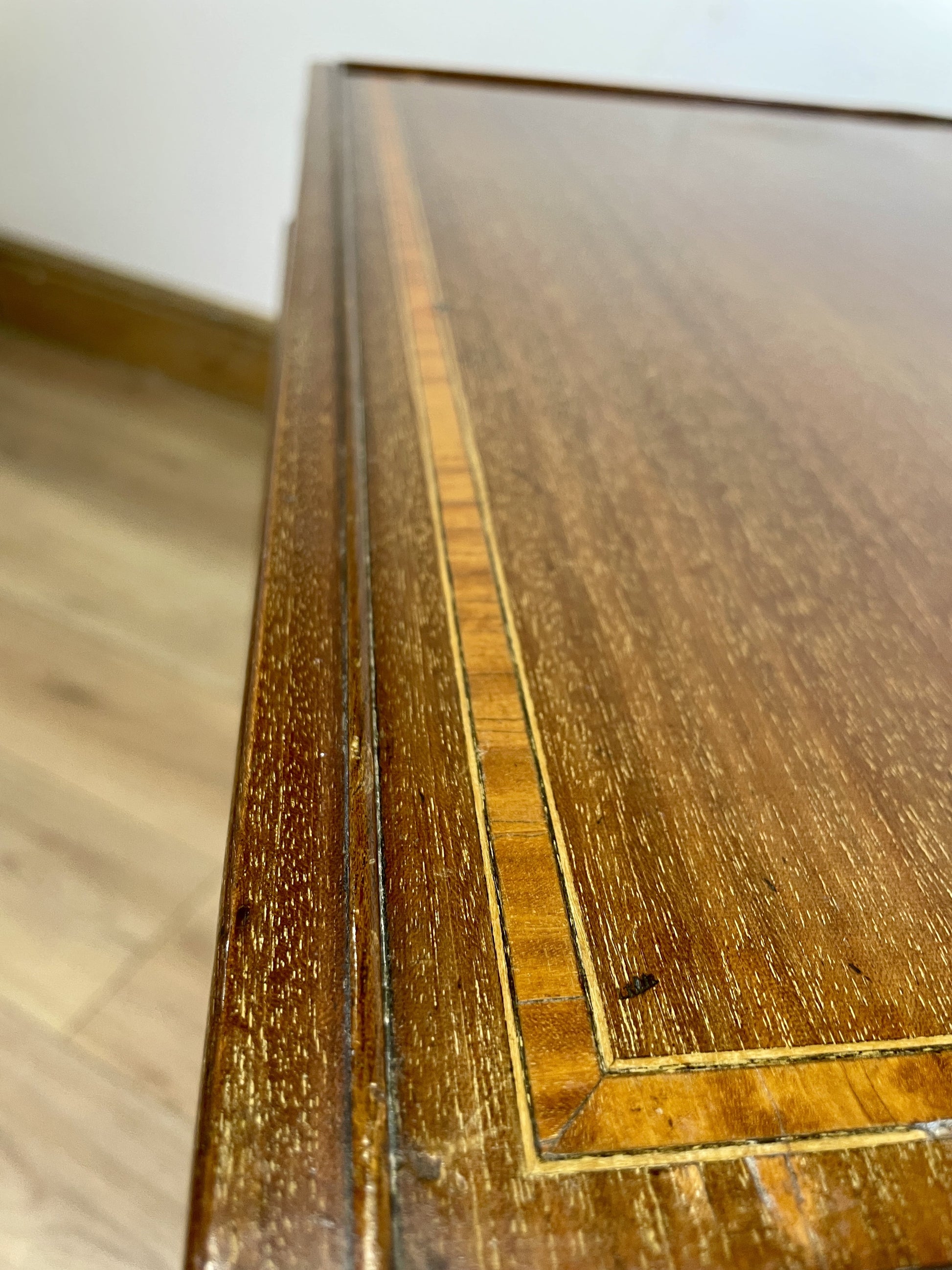 Close-up of a wooden surface with visible wear and tear