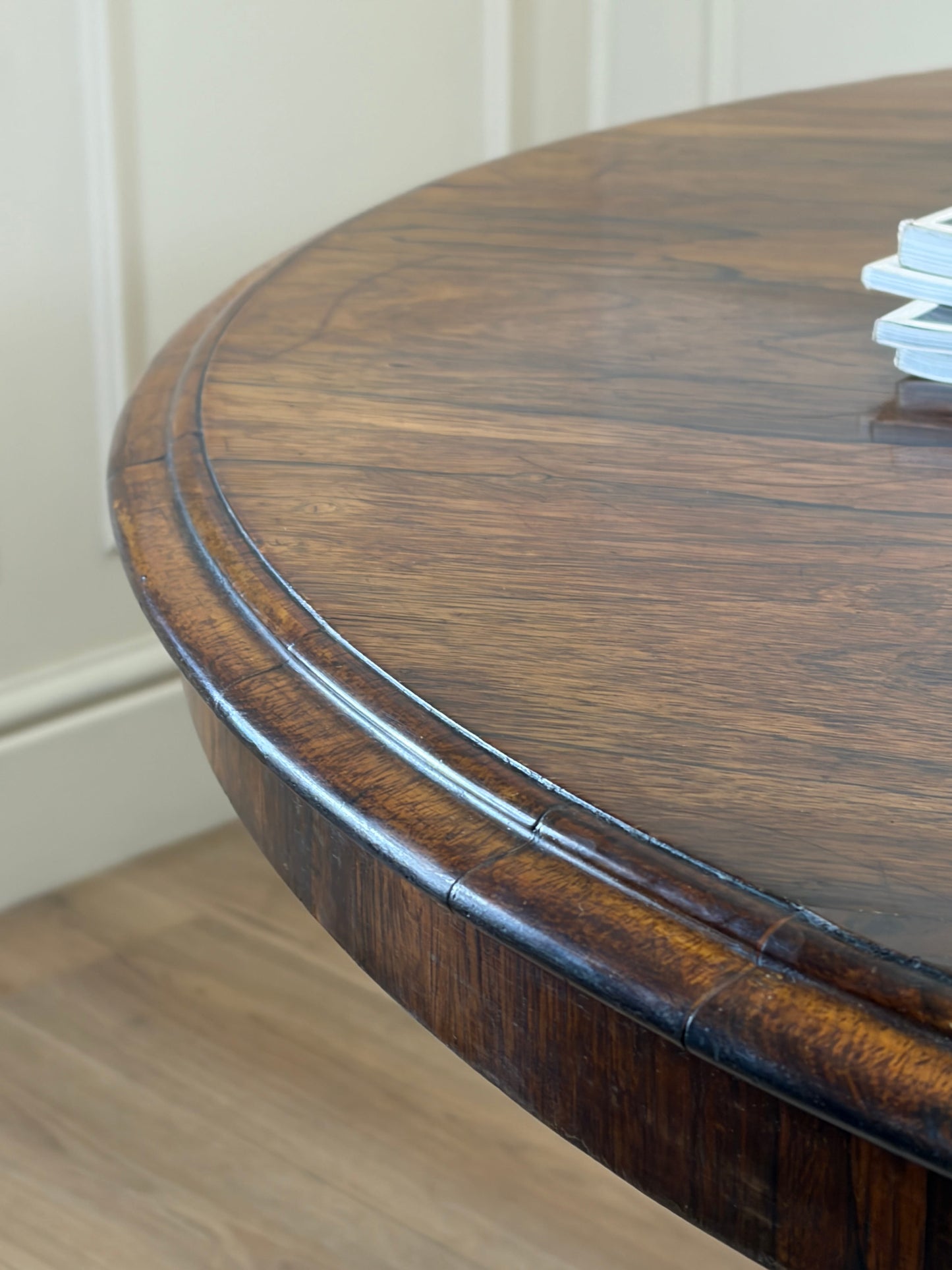 Antique Victorian rosewood breakfast table with tilt top on castors