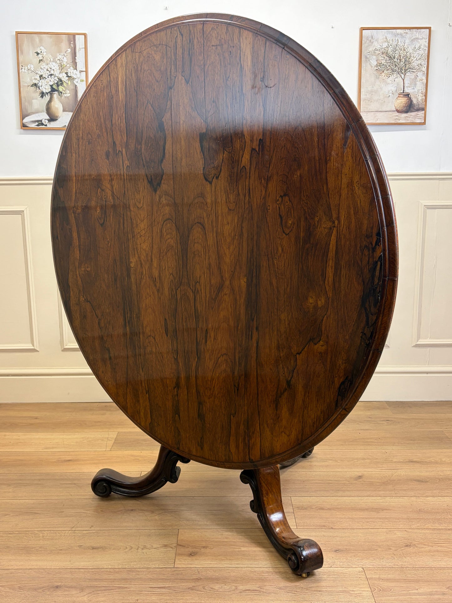 Antique Victorian rosewood breakfast table with tilt top on castors
