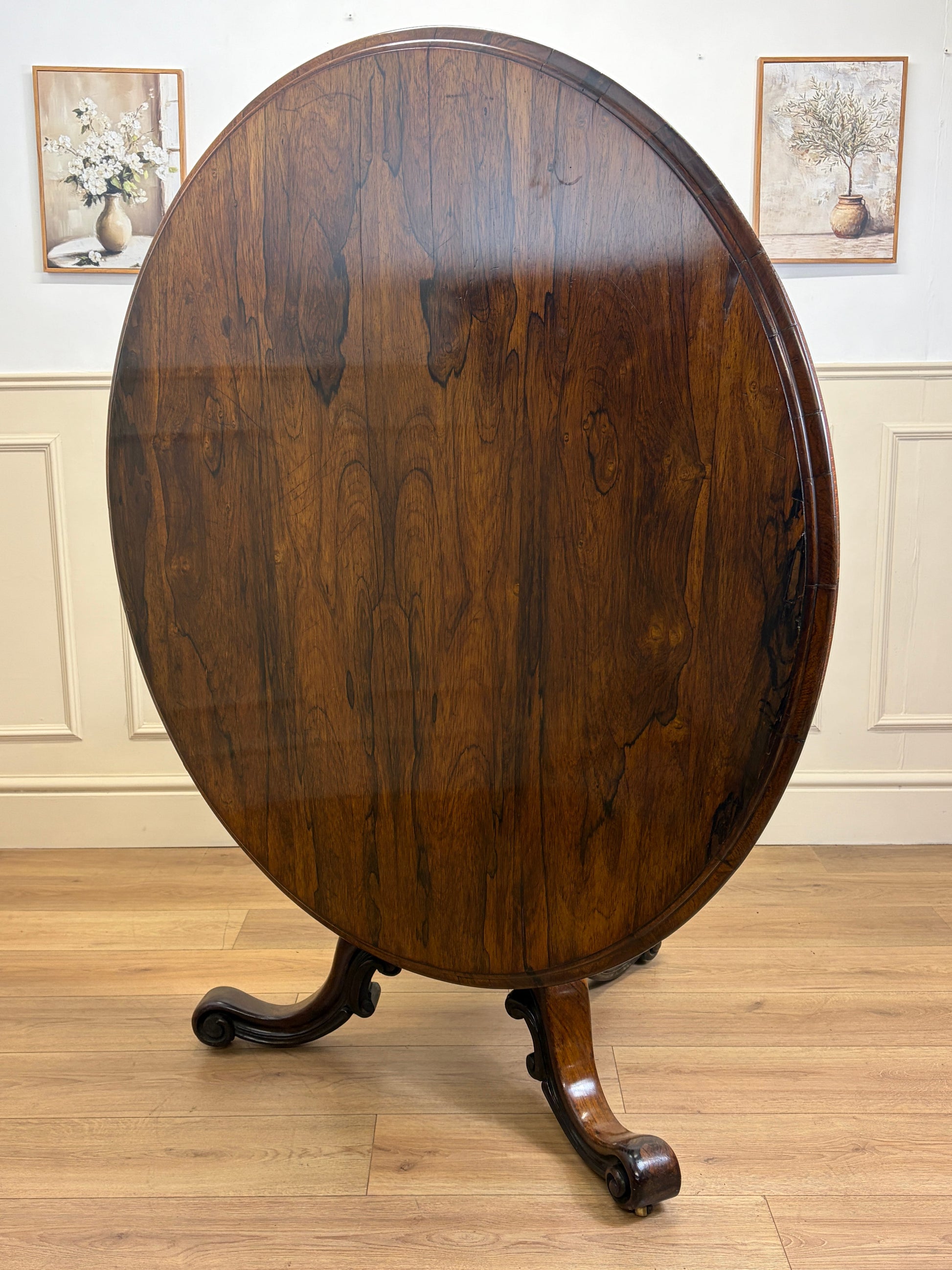 Antique Victorian rosewood breakfast table with tilt top on castors