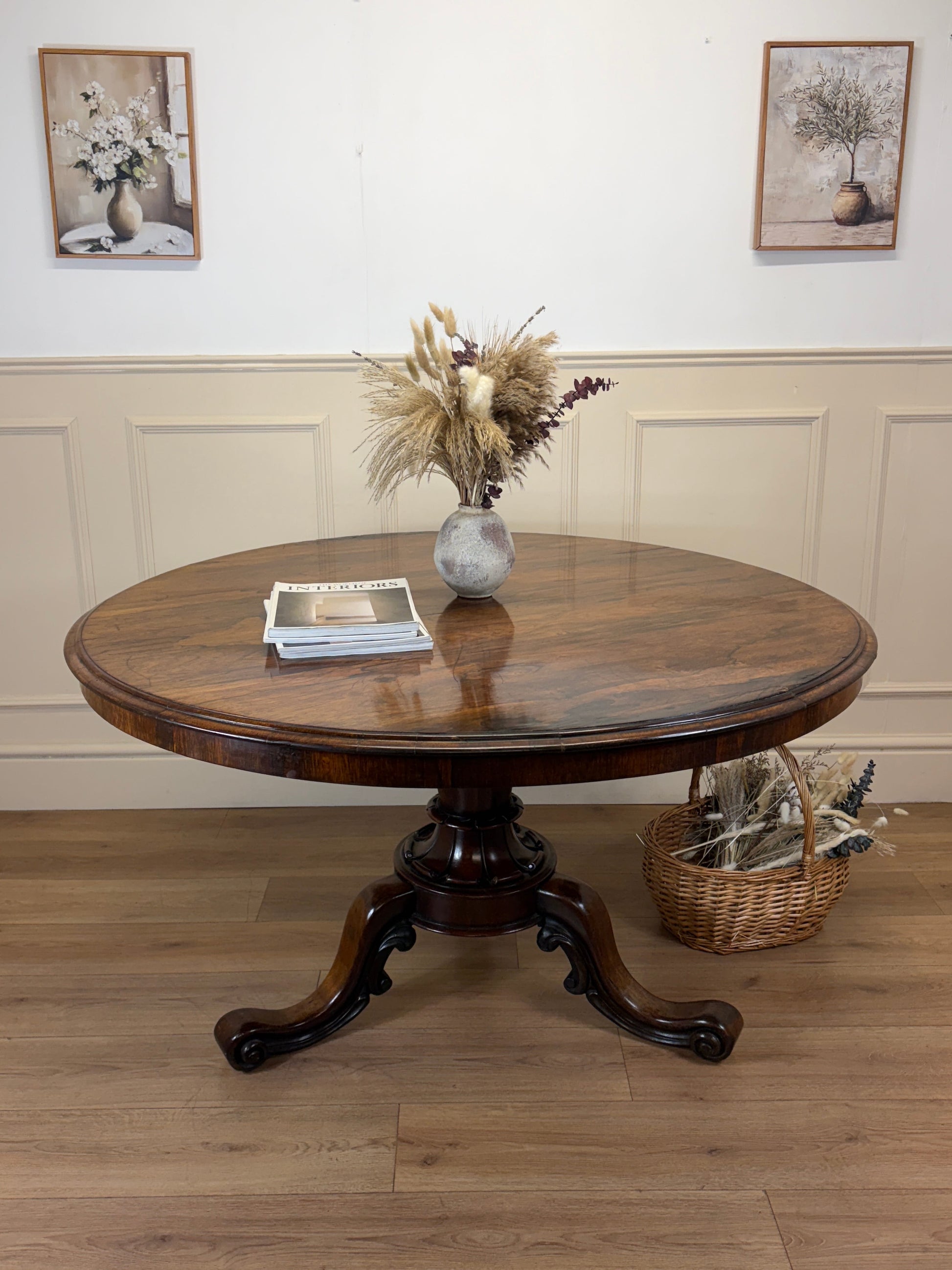 Antique Victorian rosewood breakfast table with tilt top on castors, front view
