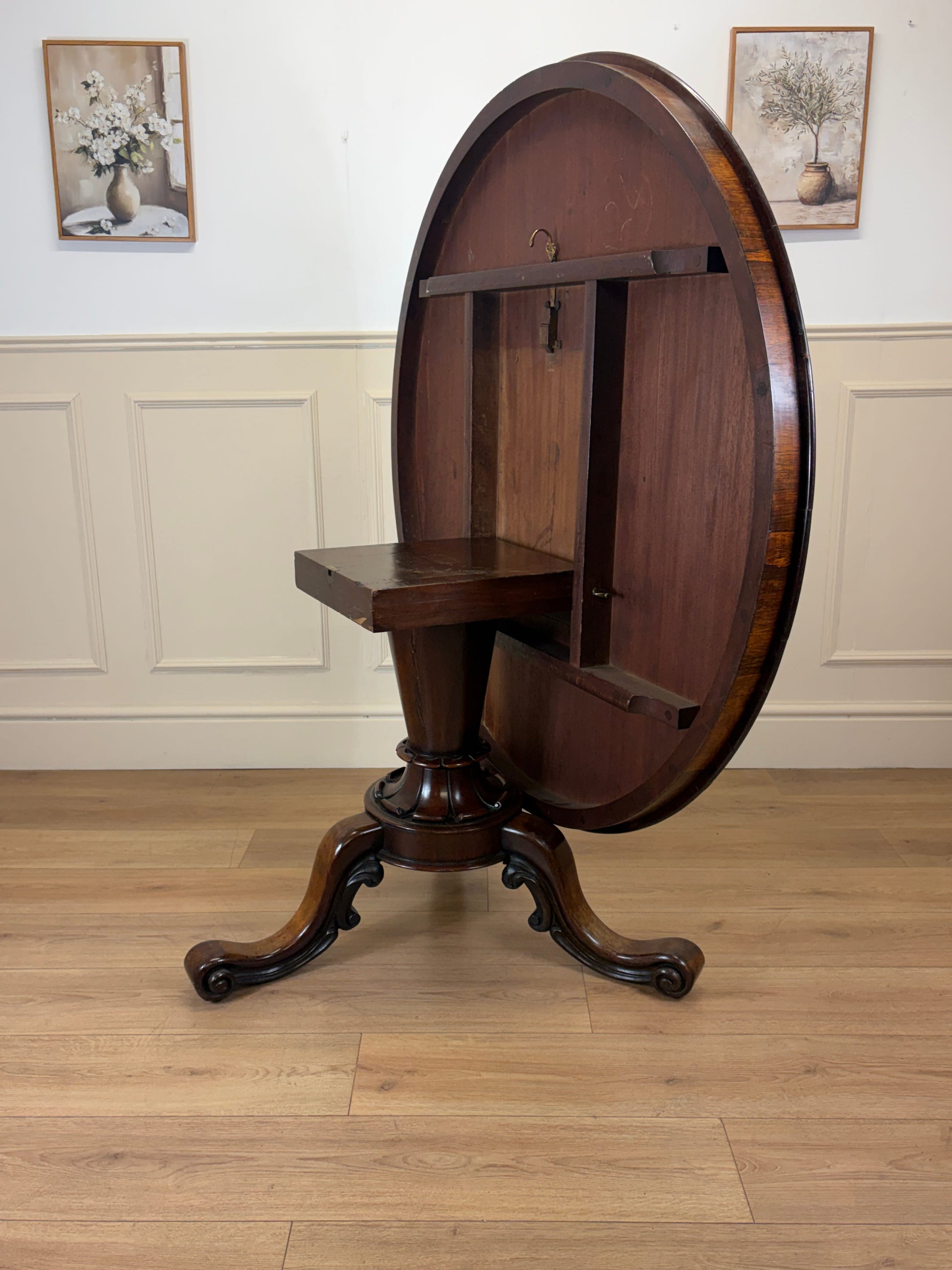 Antique Victorian rosewood breakfast table with tilt top on castors