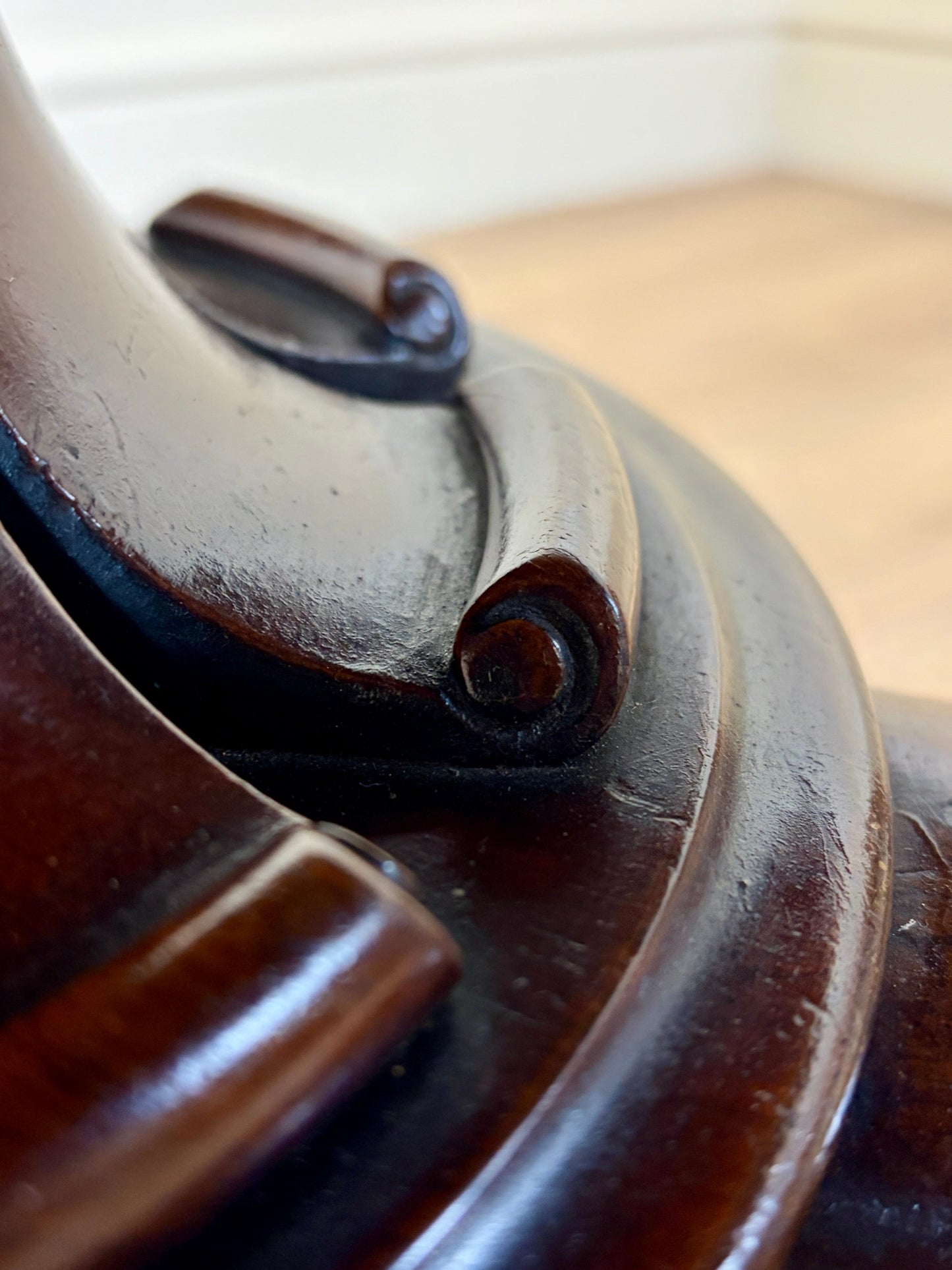 Close-up of a wooden object with a metal component