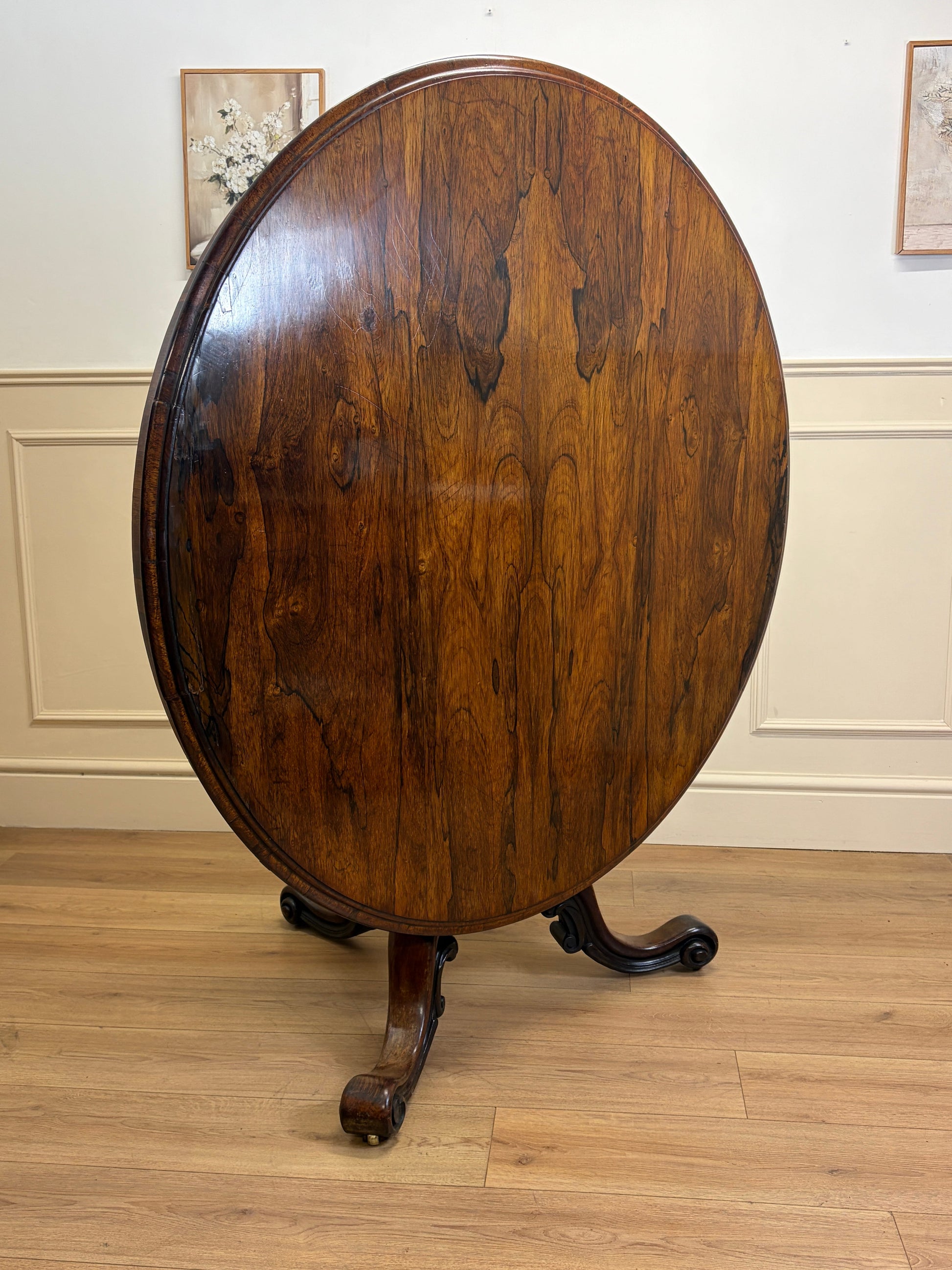 Antique Victorian rosewood breakfast table with tilt top on castors