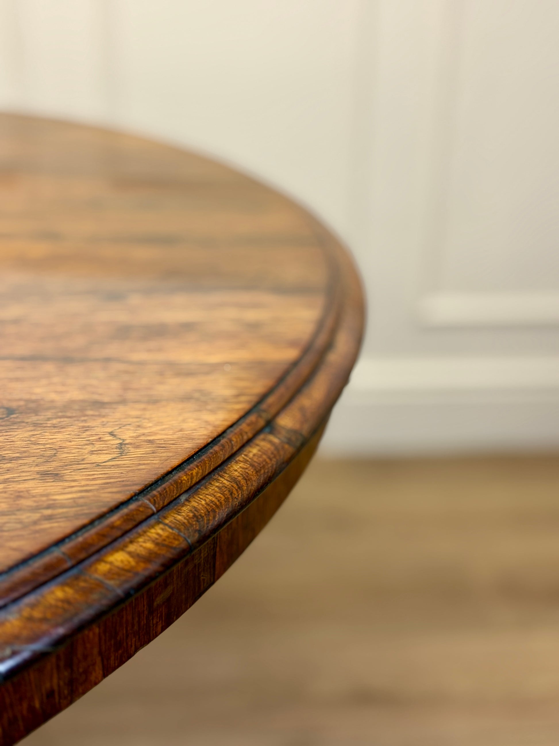 Round wooden table with a blurred background