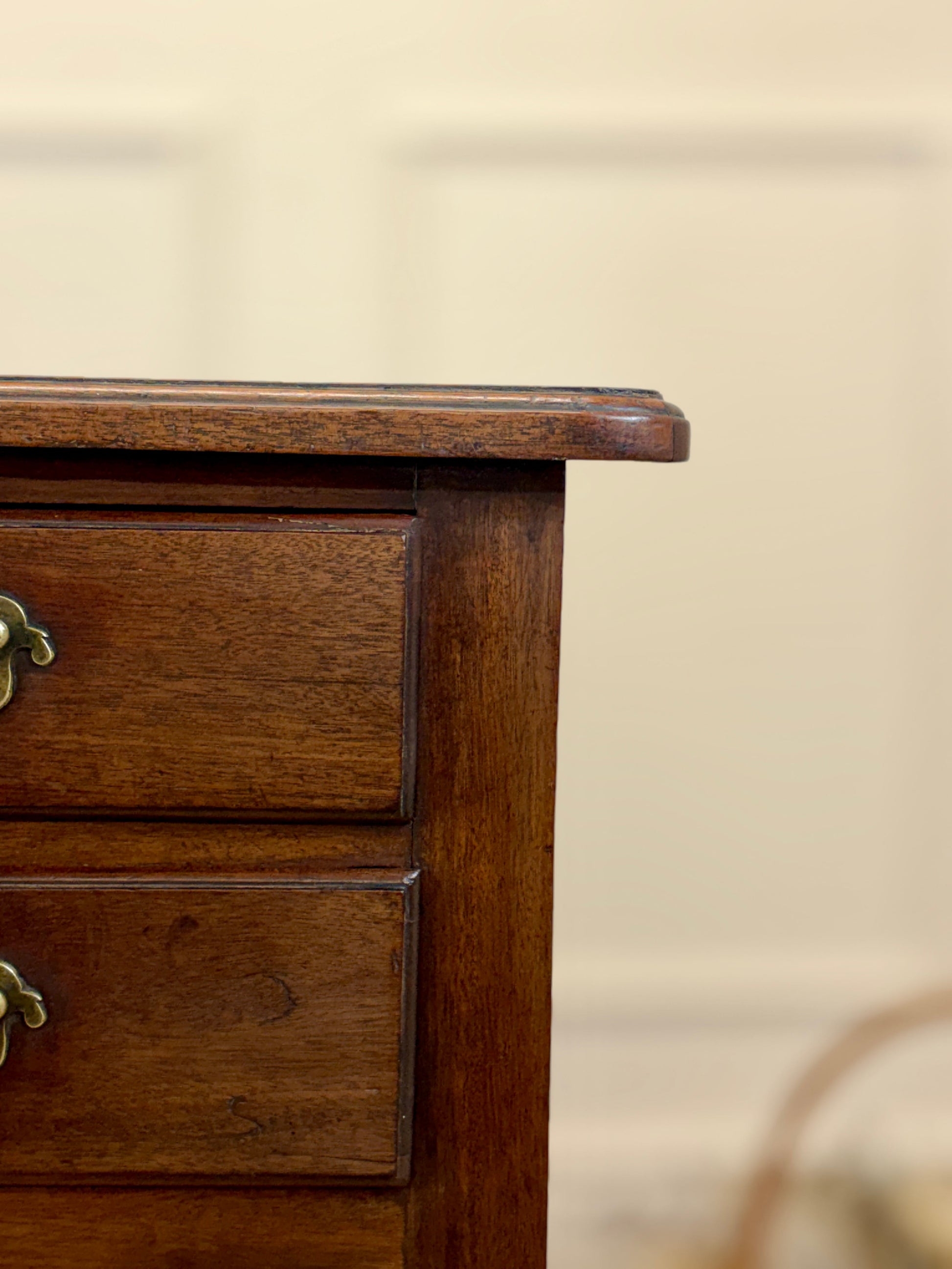 Close-up of a wooden drawer with a blurred background
