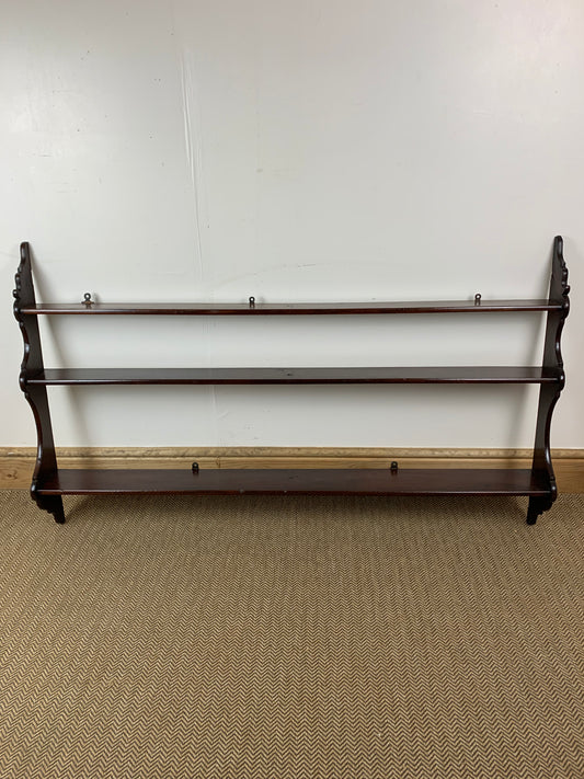 Victorian Mahogany Waterfall Shelves featuring a series of stepped shelves with a graceful cascading design, with a dark polished wood finish.