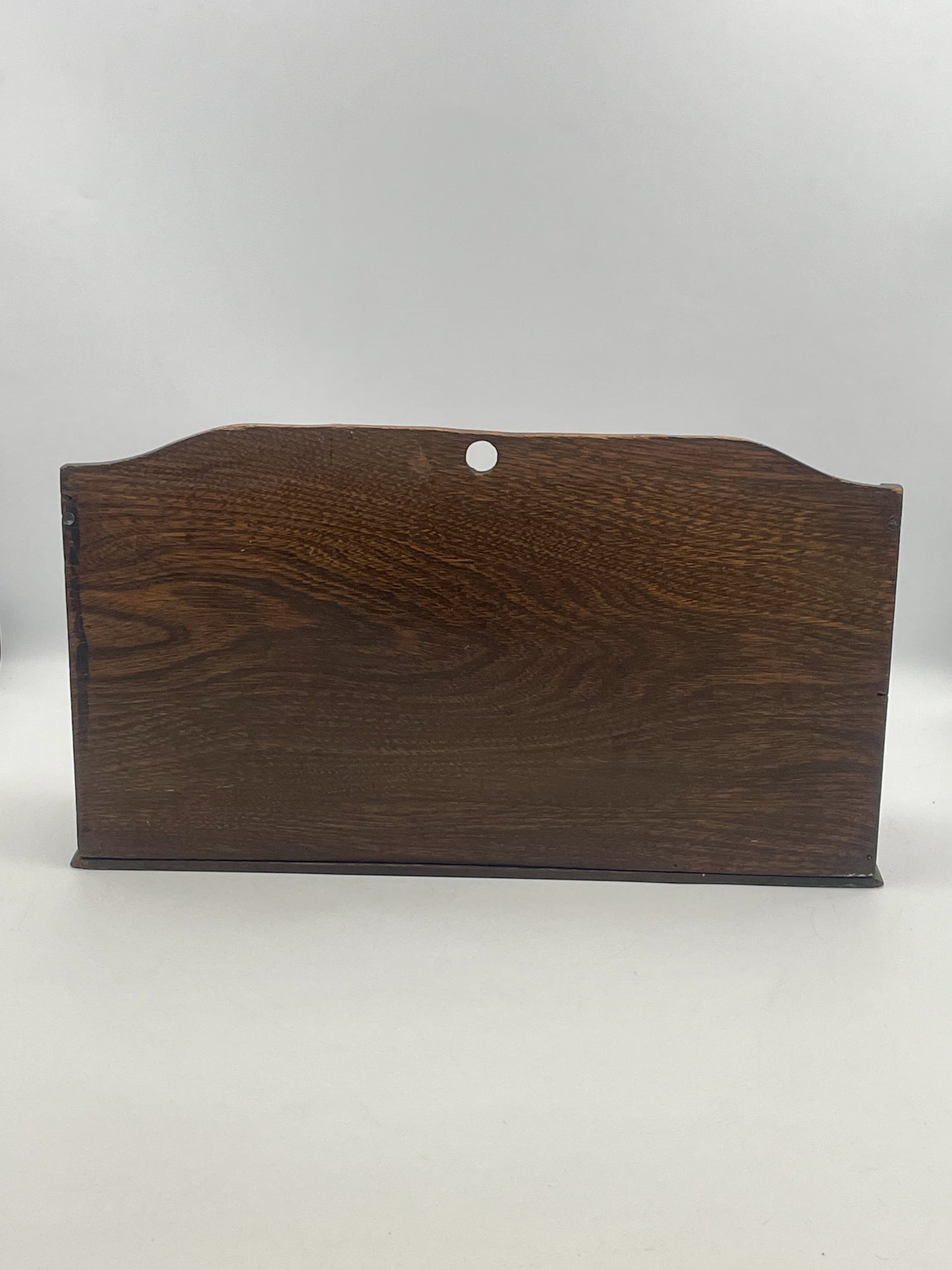 Dark brown wooden plaque on a white background