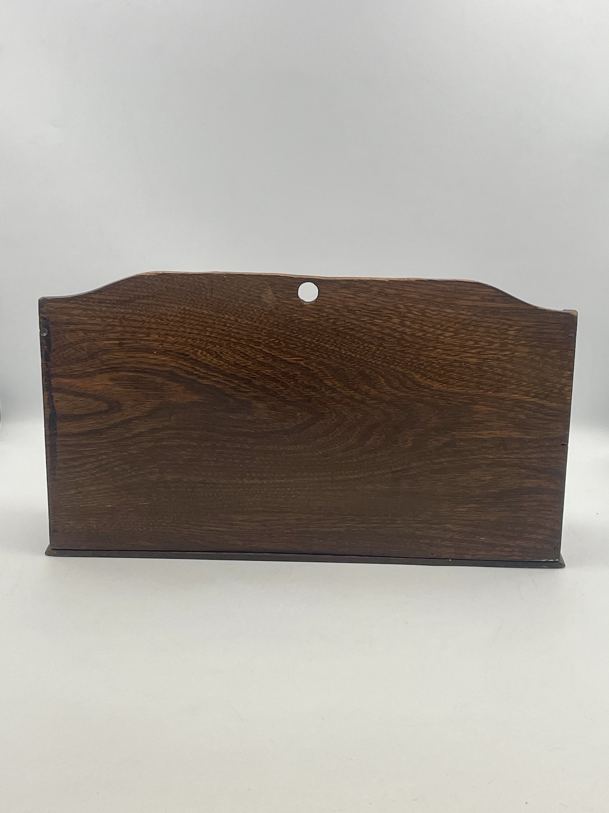 Dark brown wooden plaque on a white background