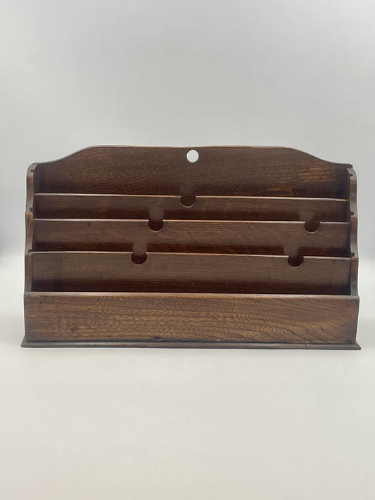 Wooden jewelry display stand on a white background