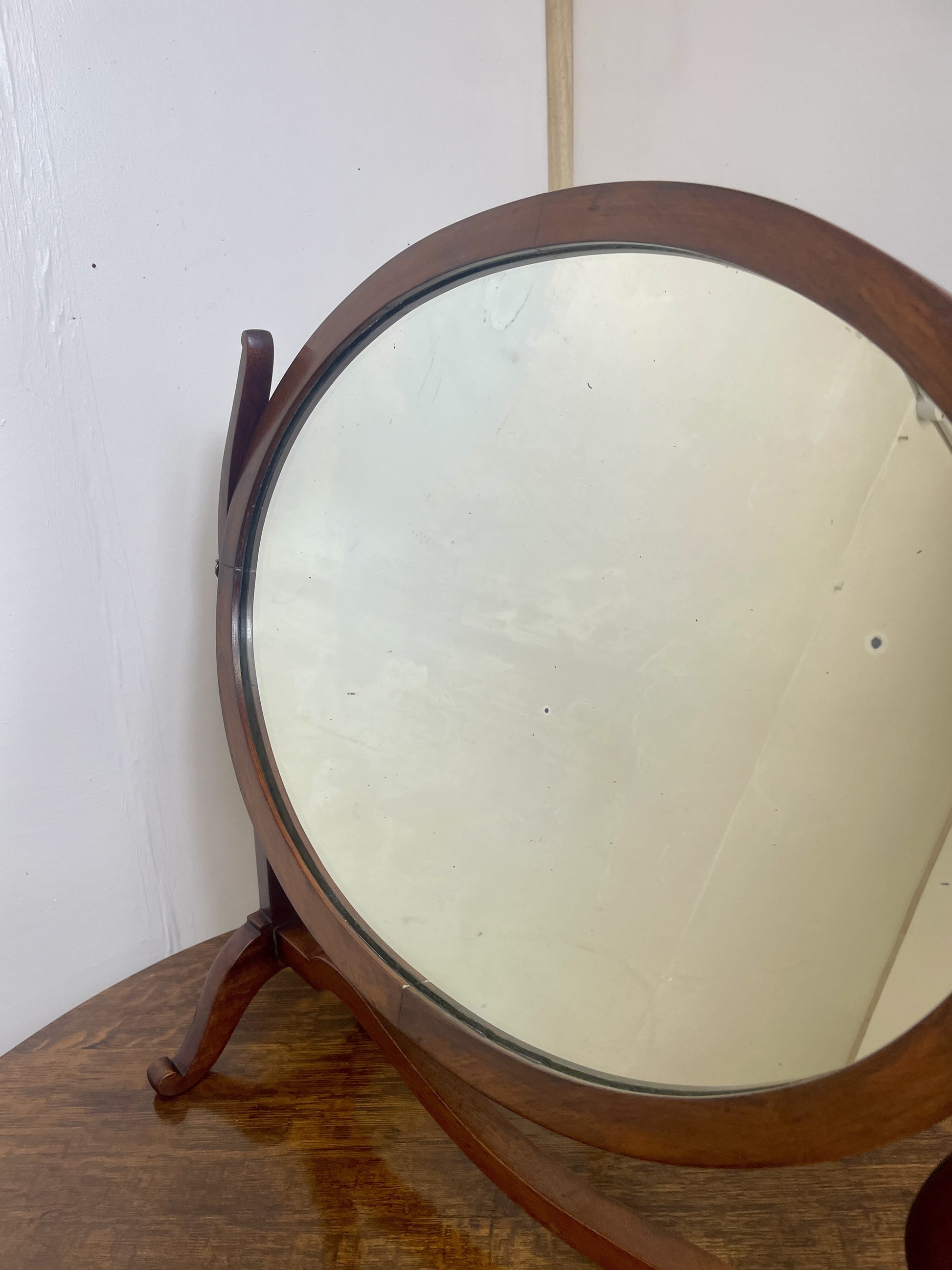 Wooden stand-up mirror with a white background