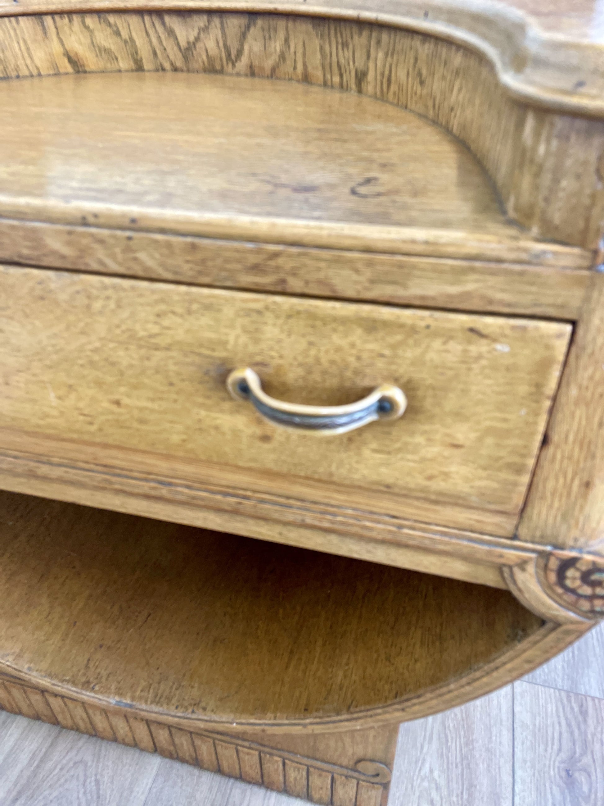 Wooden side table with a drawer and decorative edge