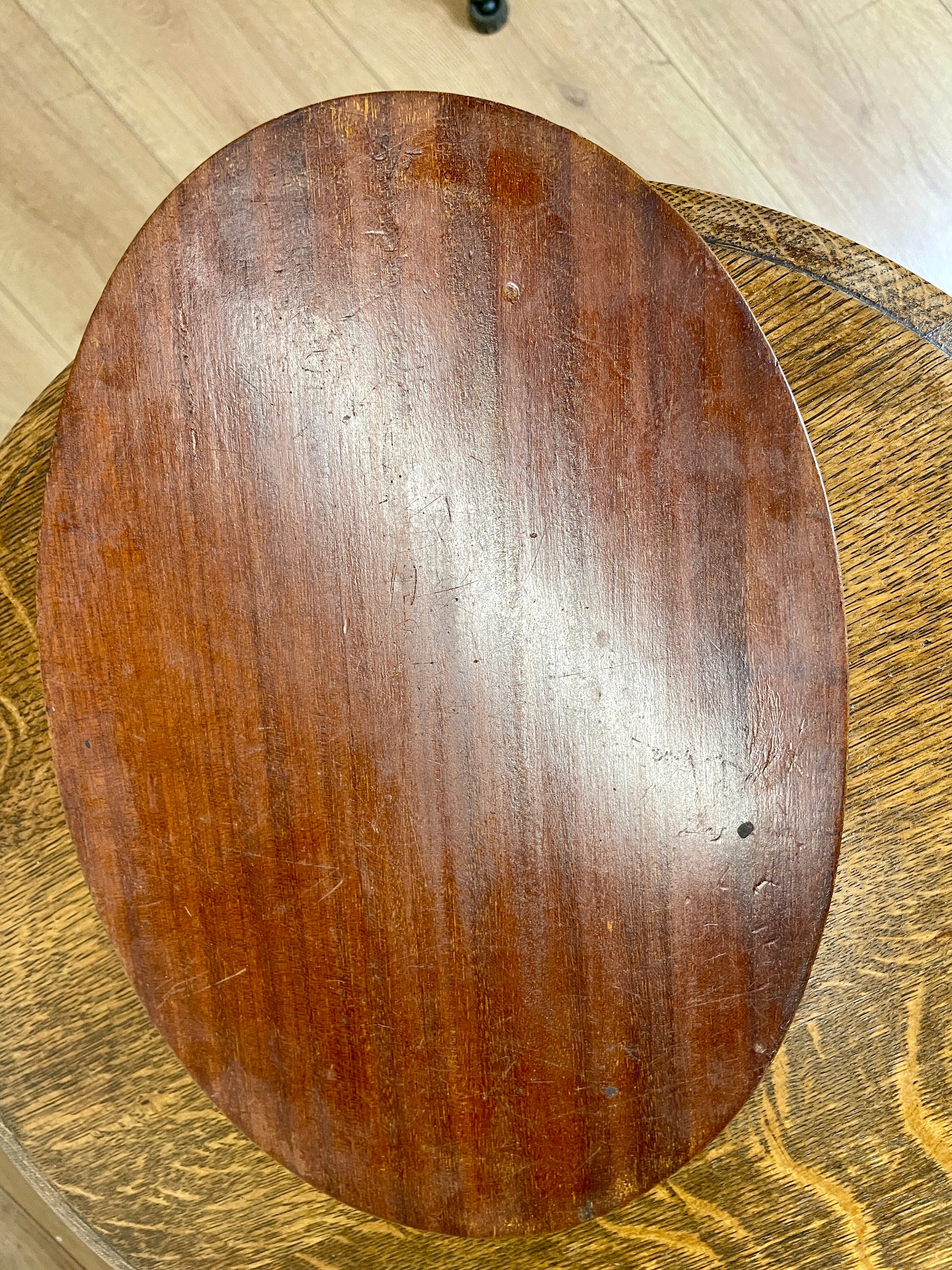 Wooden cutting board on a wooden surface
