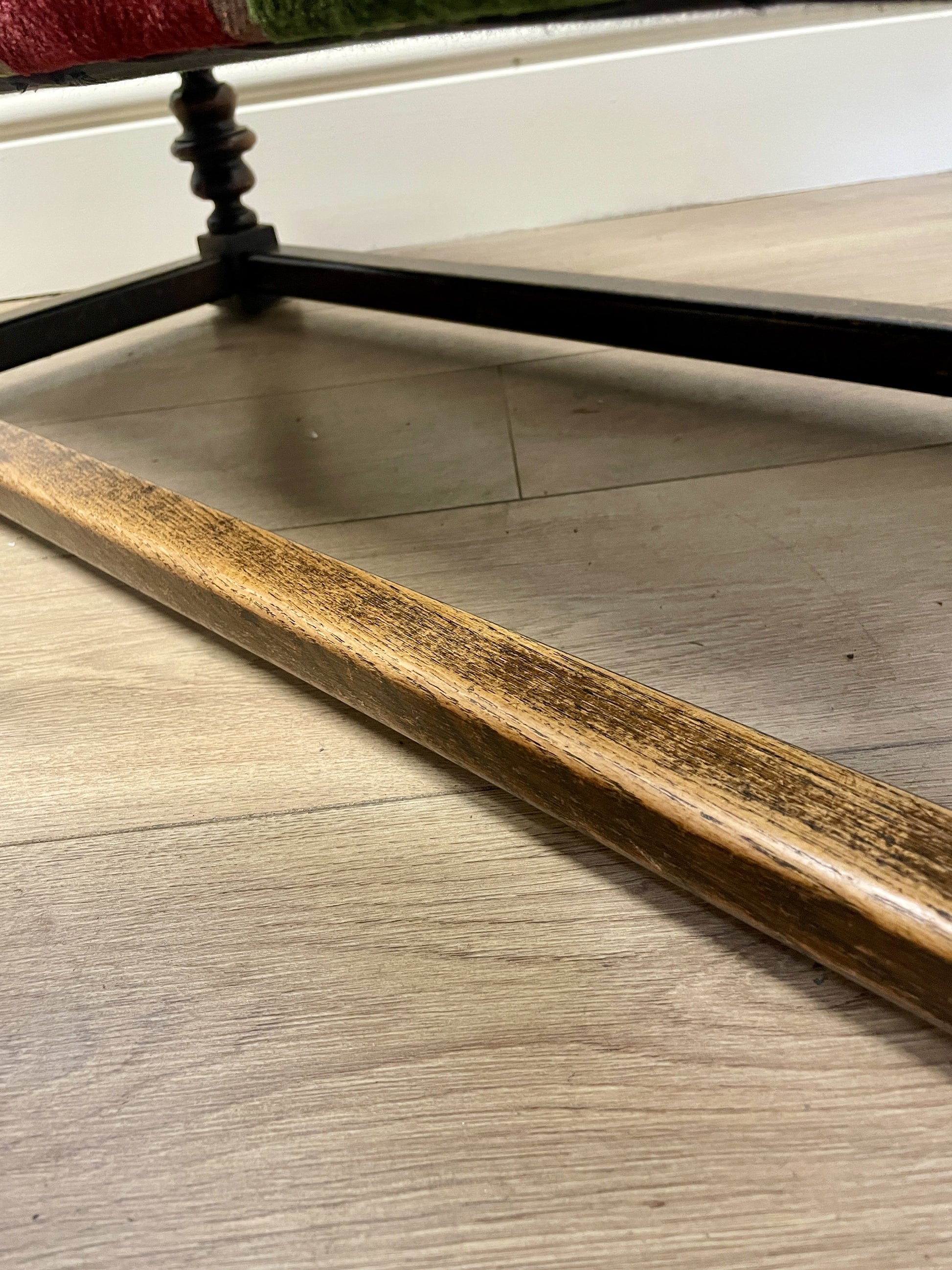 Vintage solid oak long low footstool with multicoloured upholstery and turned legs. Restored, sturdy and full of charm – a perfect accent for any living space.