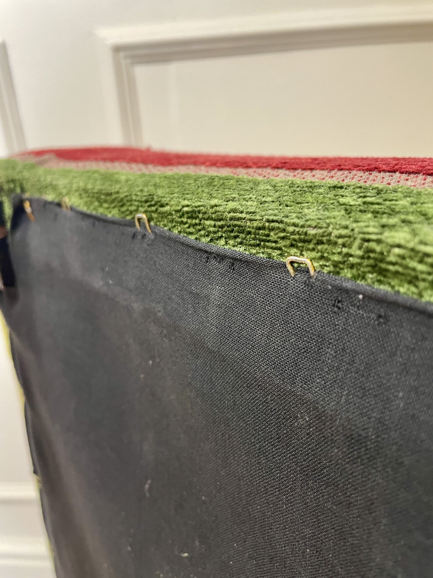 Vintage solid oak long low footstool with multicoloured upholstery and turned legs. Restored, sturdy and full of charm – a perfect accent for any living space.