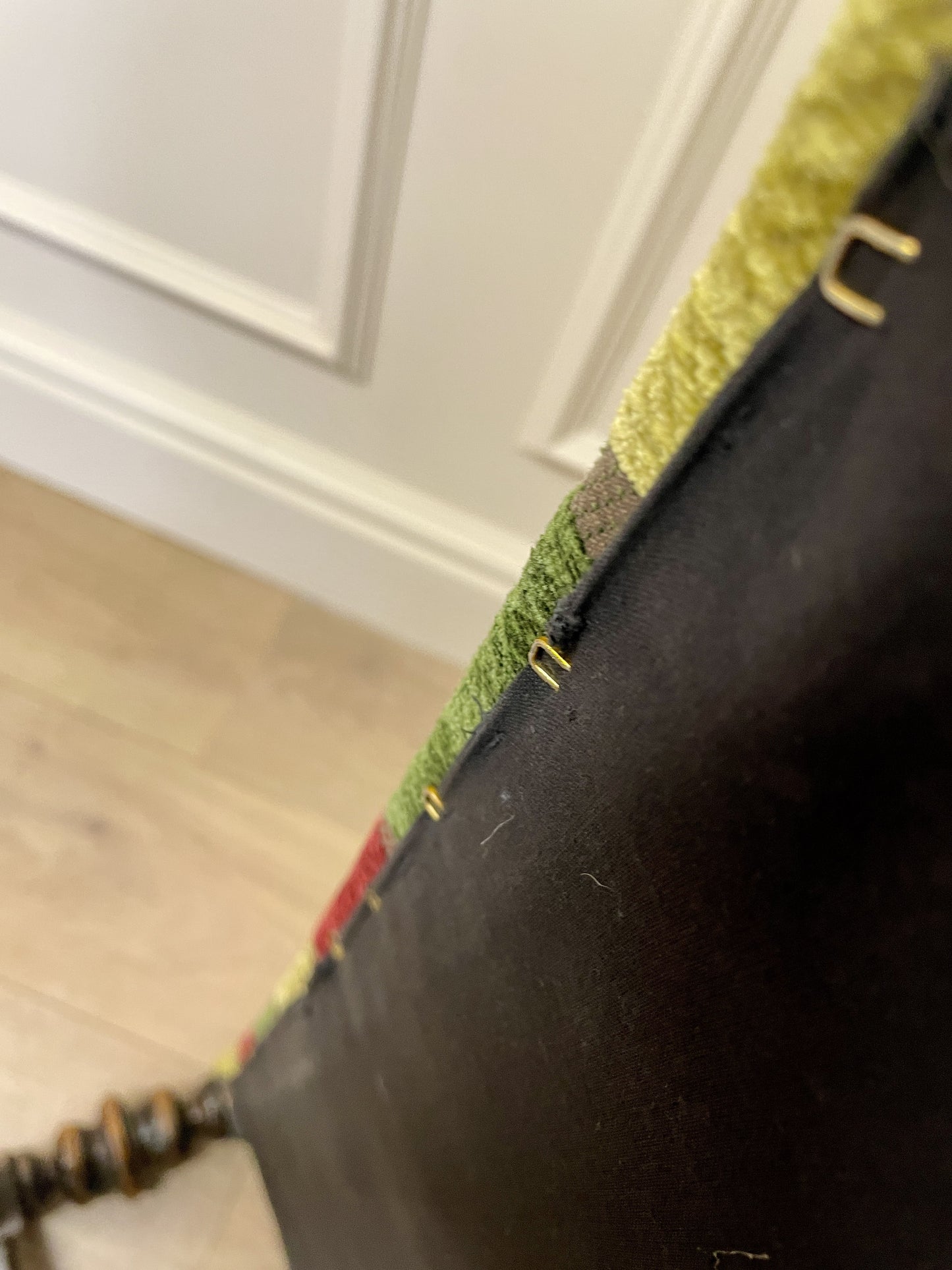 Vintage solid oak long low footstool with multicoloured upholstery and turned legs. Restored, sturdy and full of charm – a perfect accent for any living space.