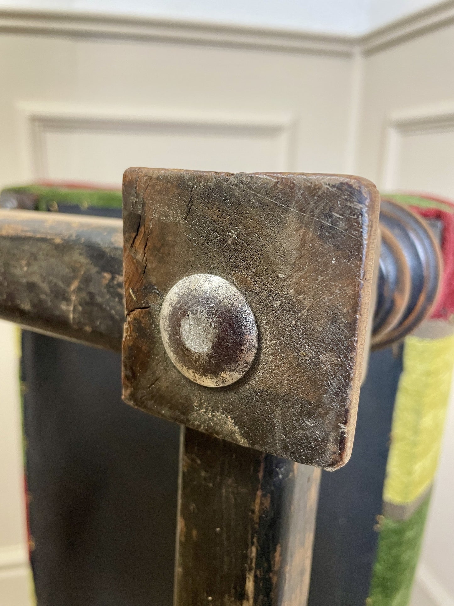 Vintage solid oak long low footstool with multicoloured upholstery and turned legs. Restored, sturdy and full of charm – a perfect accent for any living space.