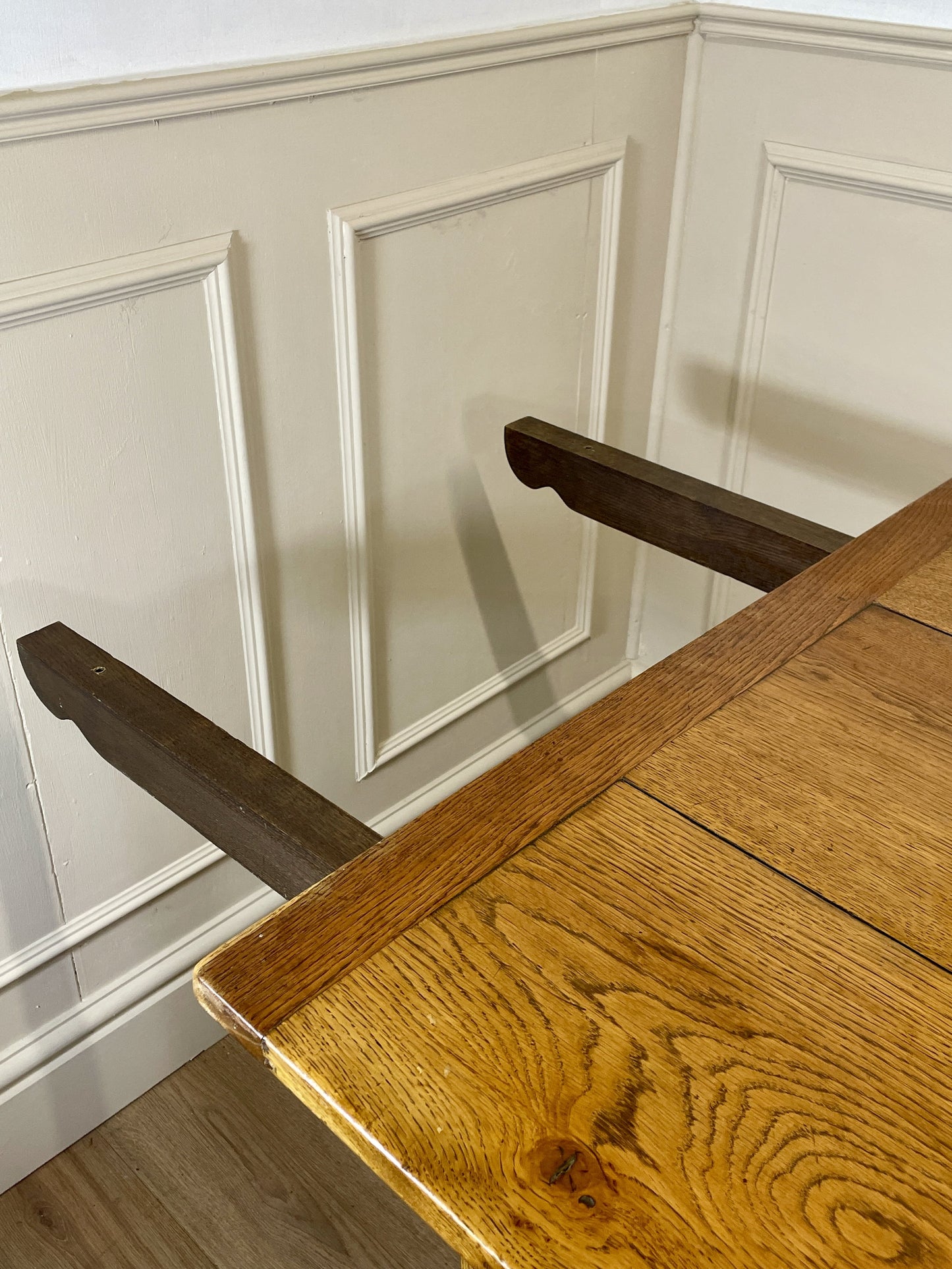 Light oak extendable dining table on square chamfered legs