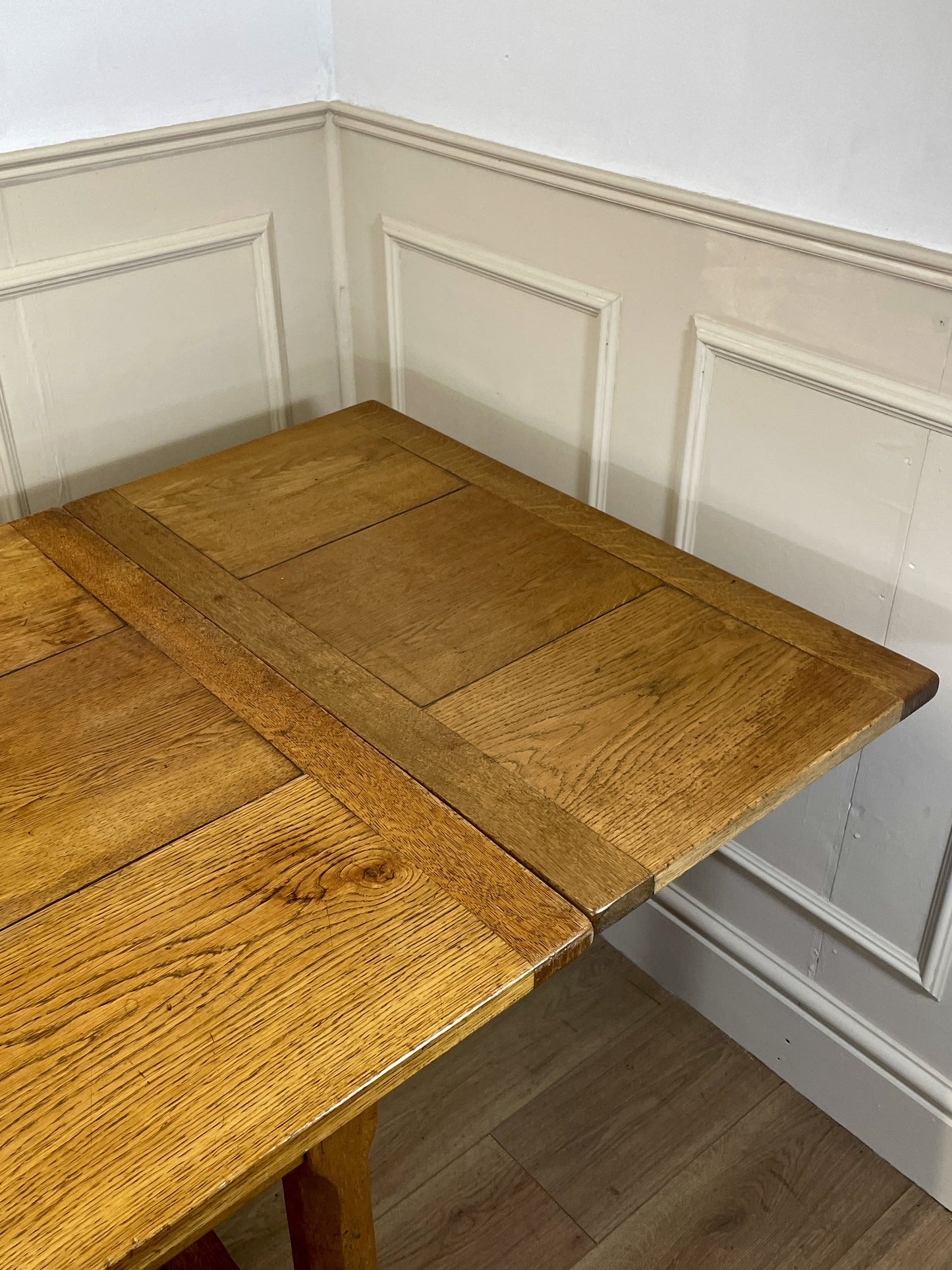 Light oak extendable dining table on square chamfered legs