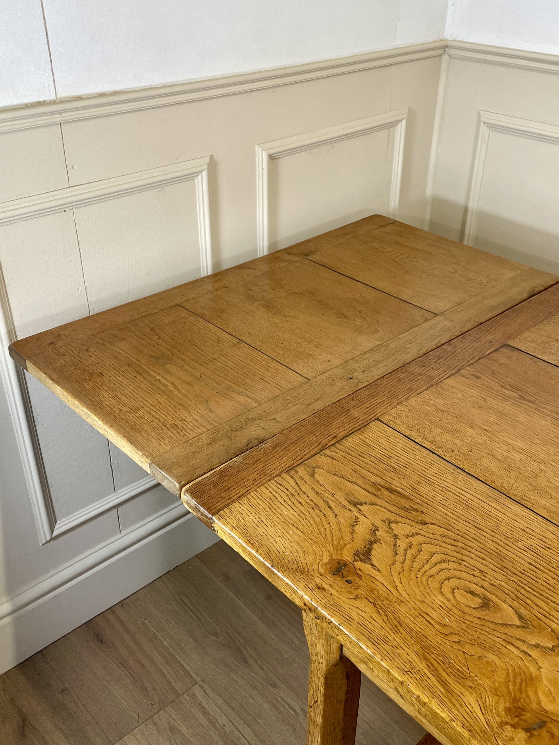 Light oak extendable dining table on square chamfered legs