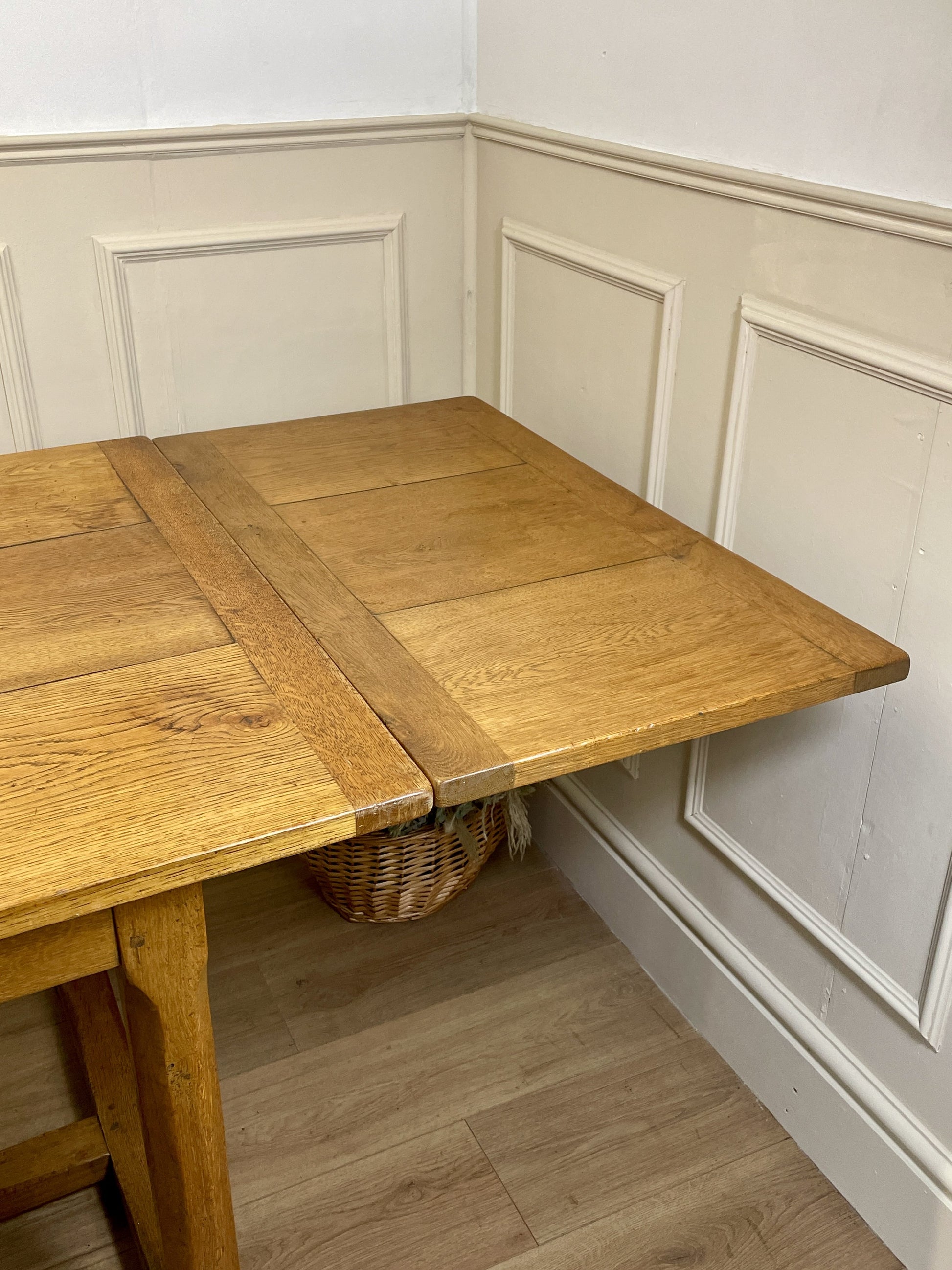 Light oak extendable dining table on square chamfered legs